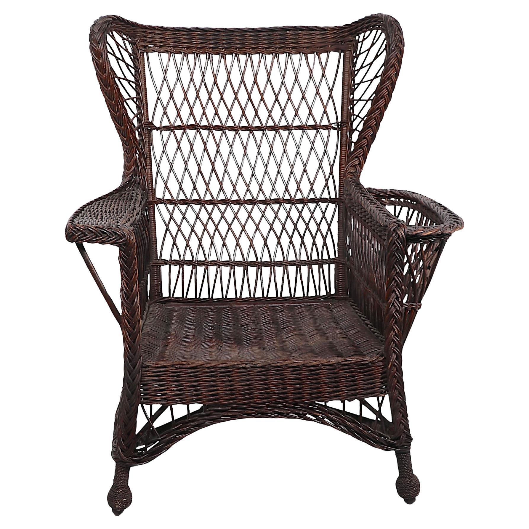 Victorian Bar Harbor Wicker Wing Chair with Magazine Rack Arm en vente