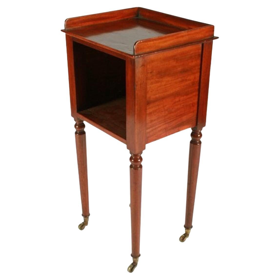 Victorian Mahogany bedside cabinet

A mid 19th century Victorian mahogany open front bedside cabinet.

The cabinet has a gallery back and stands on four turned legs with brass casters.

The cabinet is in good condition and has had the polish