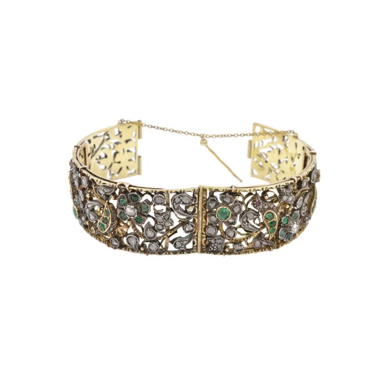 Silver topped 18k yellow gold Victorian bird and flower motif, old cut Emerald and rose cut diamond Bangle bracelet. There is an interior brace likely added at a later date, marked 14k, circa 1870.  Will fit up to a seven inch wrist, and it