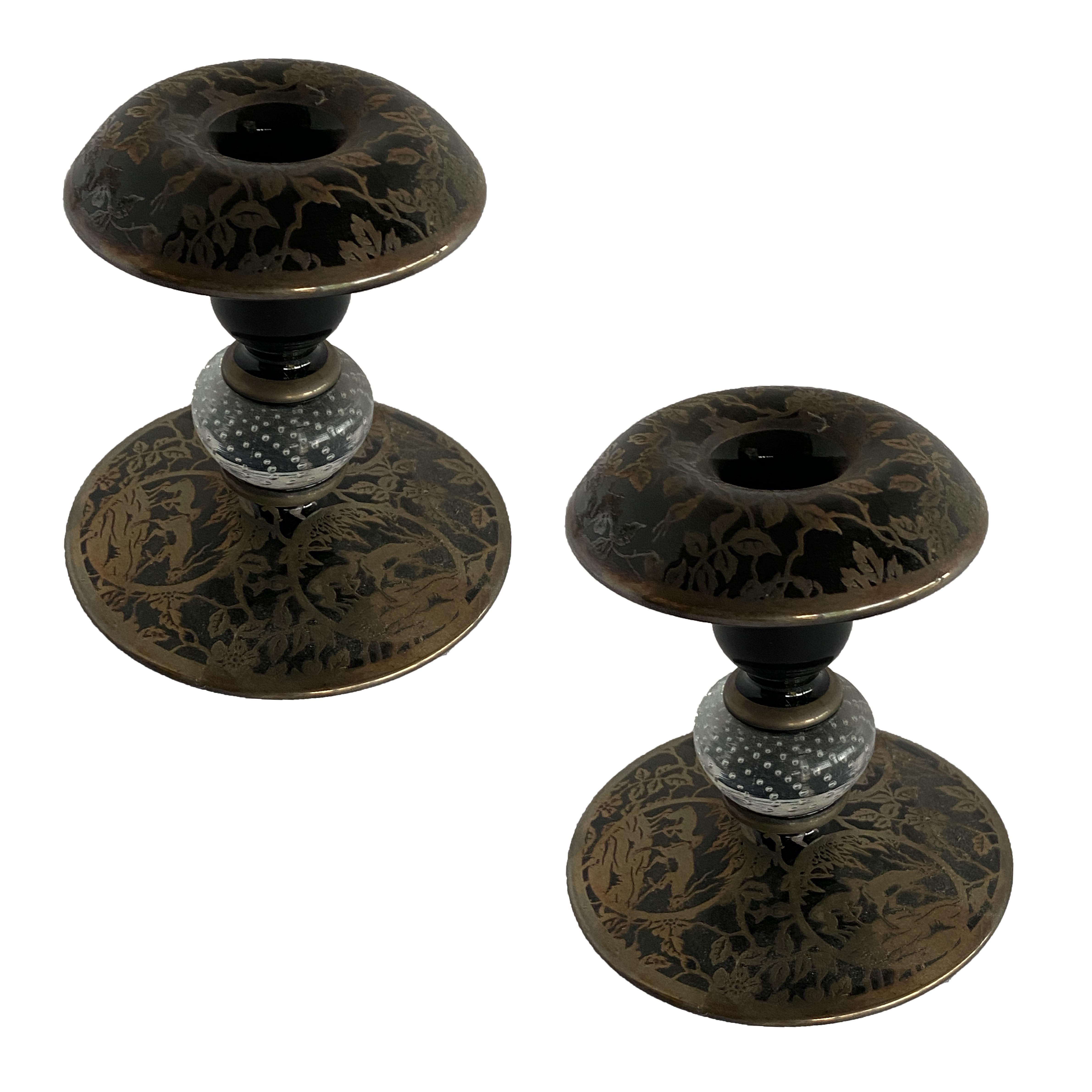 Pair of Victorian-era black amethyst candle holders featuring scrolling silver overlay/inlay leaf pattern.

Circa 1890