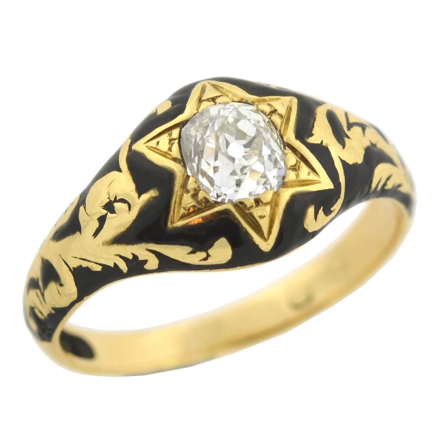 An outstanding diamond ring from the Victorian (ca1880) era! This fantastic piece is crafted in vibrant 18kt yellow gold, and has an impressive enameled design. Resting at the center is a gorgeous six-point star engraved motif which holds a