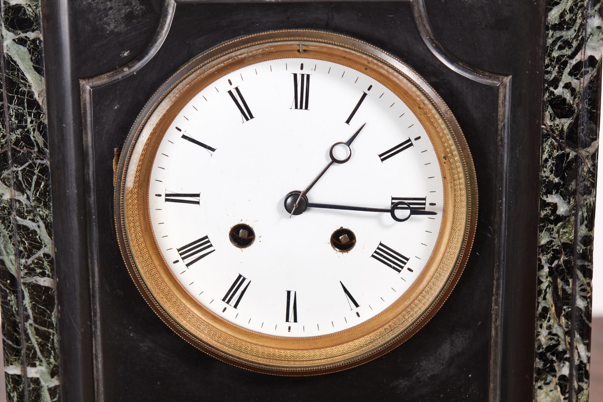 Victorian black marble mantel clock, with a white enamel dial, eight day French movement which strikes the hour and half hour on a bell, good working order
Original key
Measures: 11