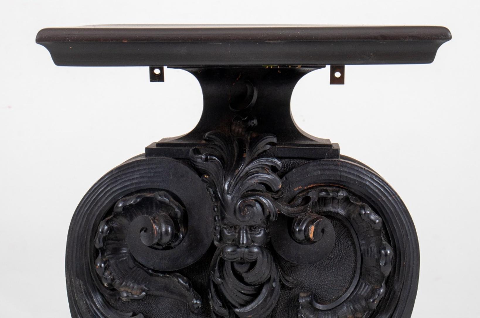 Victorian black-painted small hall console with square top and volute form body.

Dimensions: 35