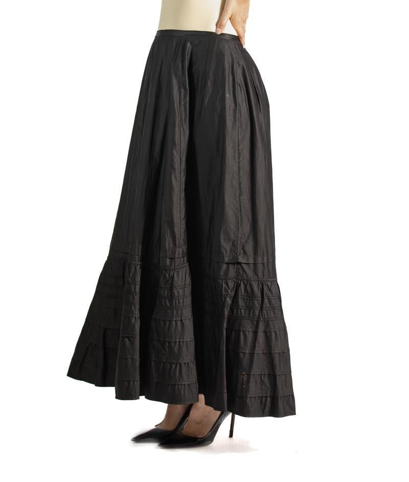 In very good and strong wearable condition, does show some signs of age in a few spots here and there.  Victorian Black Silk & Cotton Sateen Skirt 