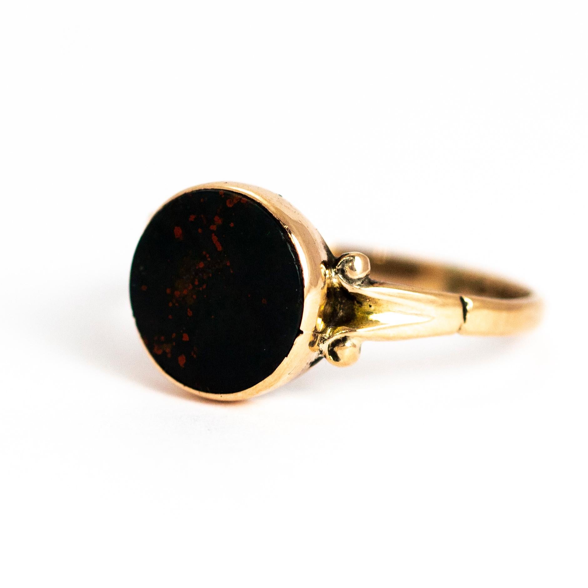 This Victorian piece hold a beautifully simple circular bloodstone set in a 9ct gold ring with scroll detailed shoulders. Made in Chester, United Kingdom.

Ring Size: Q or 8