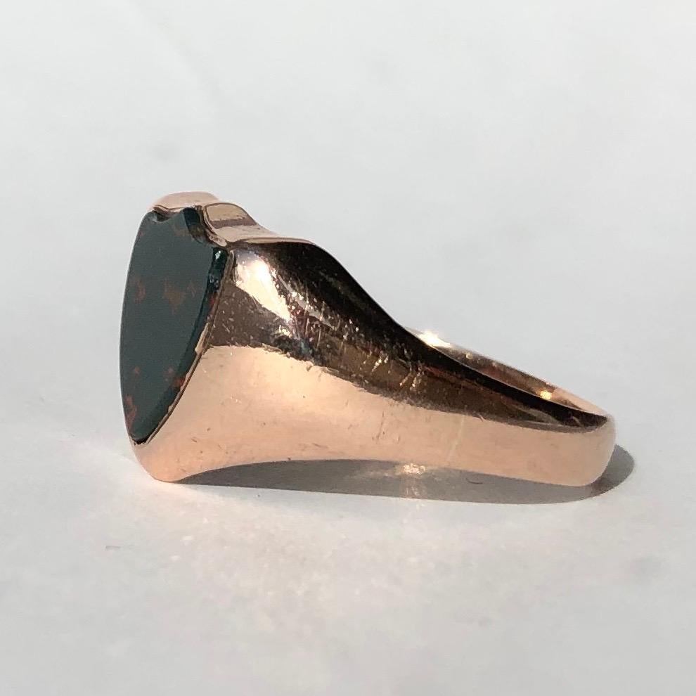 This ring is modelled in gorgeous soft 9ct rose gold. The bloodstone is in the shape of a shield and is set within the glossy gold. Made in Birmingham, England. 

Ring Size: P 1/2 or 7 3/4
Widest point: 12mm

Weight: 4.28g