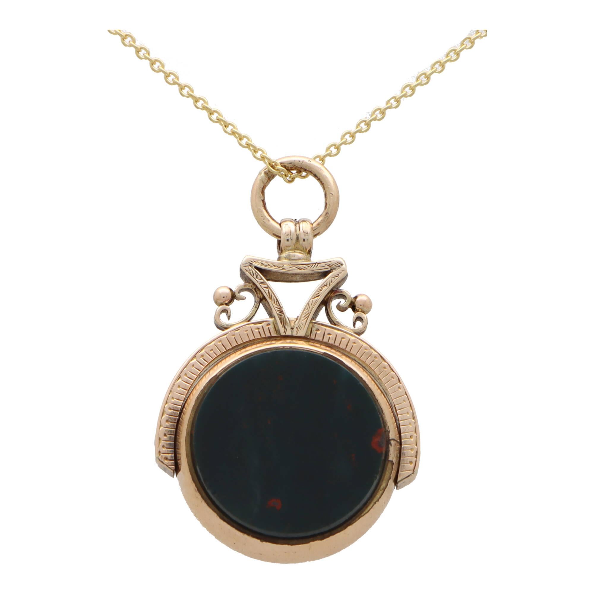  A rather unique antique Victorian bloodstone and carnelian swivel fob pendant set in 9k yellow gold.

The piece is predominantly set with a reversible fob aspect set to each side with a green bloodstone and brownish-orange carnelian stone. The