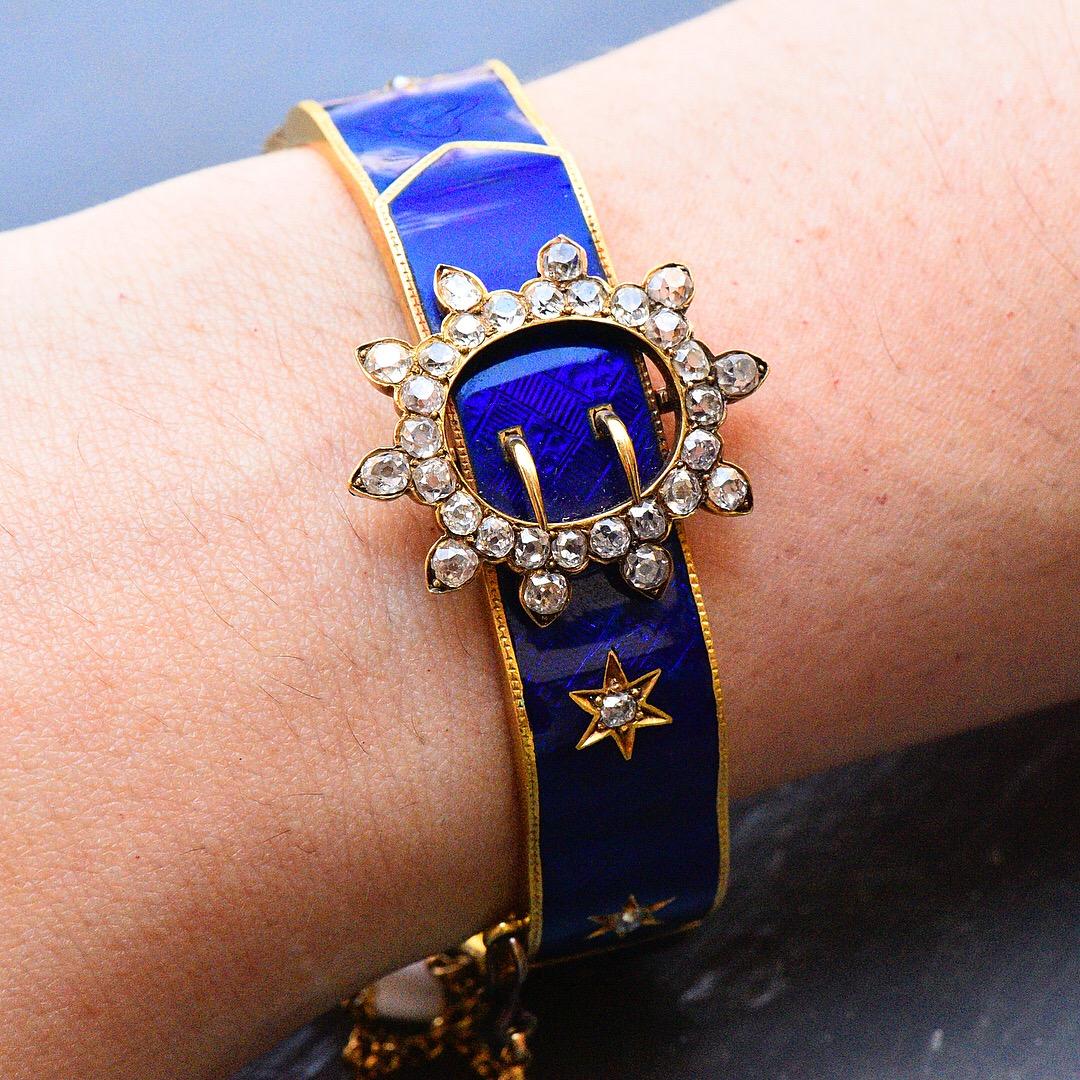 Victorian Blue Enamel and Mine Cut Diamond Buckle Bracelet. The electric blue enamel is in great original condition. The bracelet is circa 1880 and is crafted in 18K yellow gold. The enamel is a wavy design. The circle star is set with  3 carats