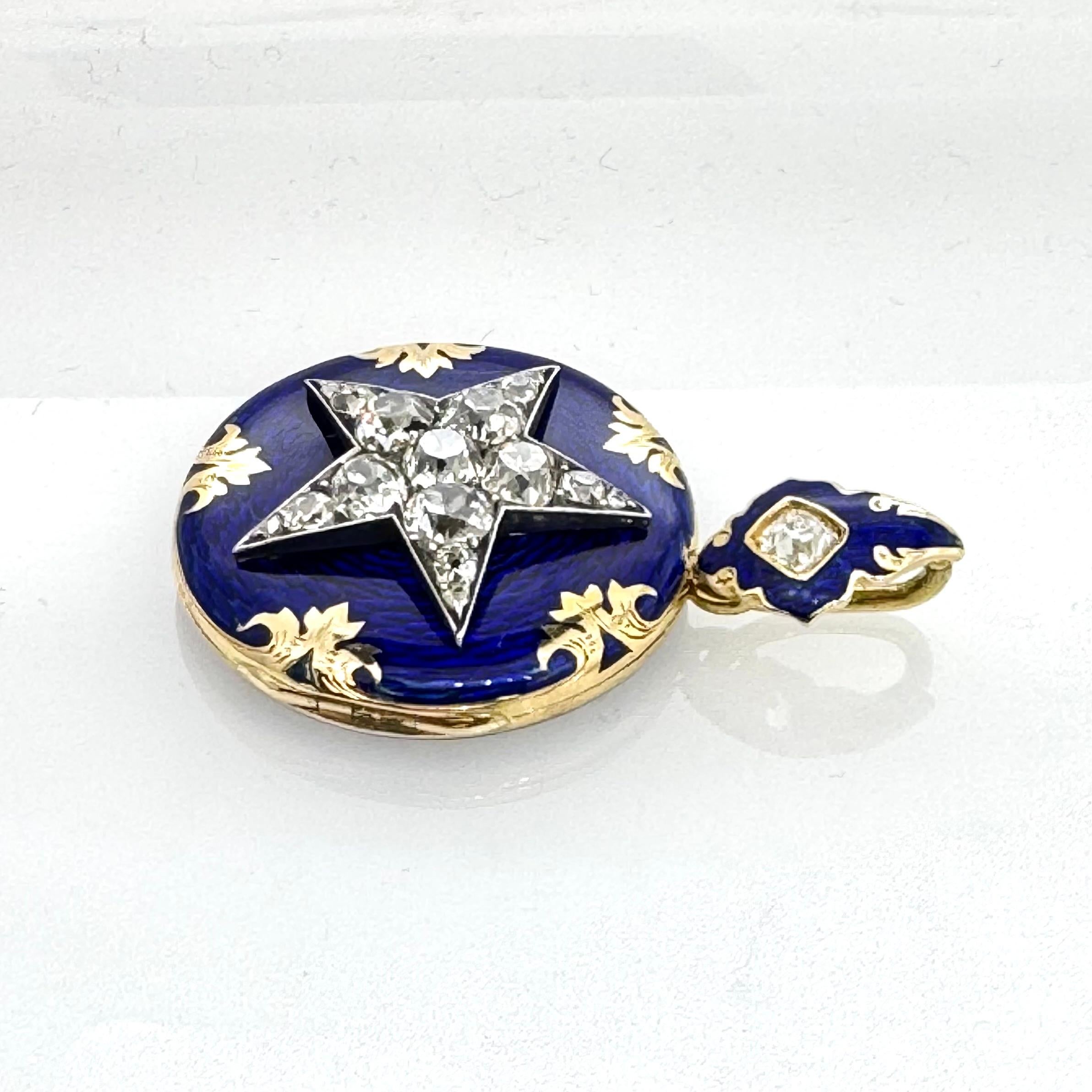 Unique antique locket/pendant with a five-rayed diamond-set star on a cobalt blue guilloche enamel cover.
18ct yellow gold designed with an intricatly hand engraved patterns at the front and on the back.
The star is encrusted with 17 round faceted