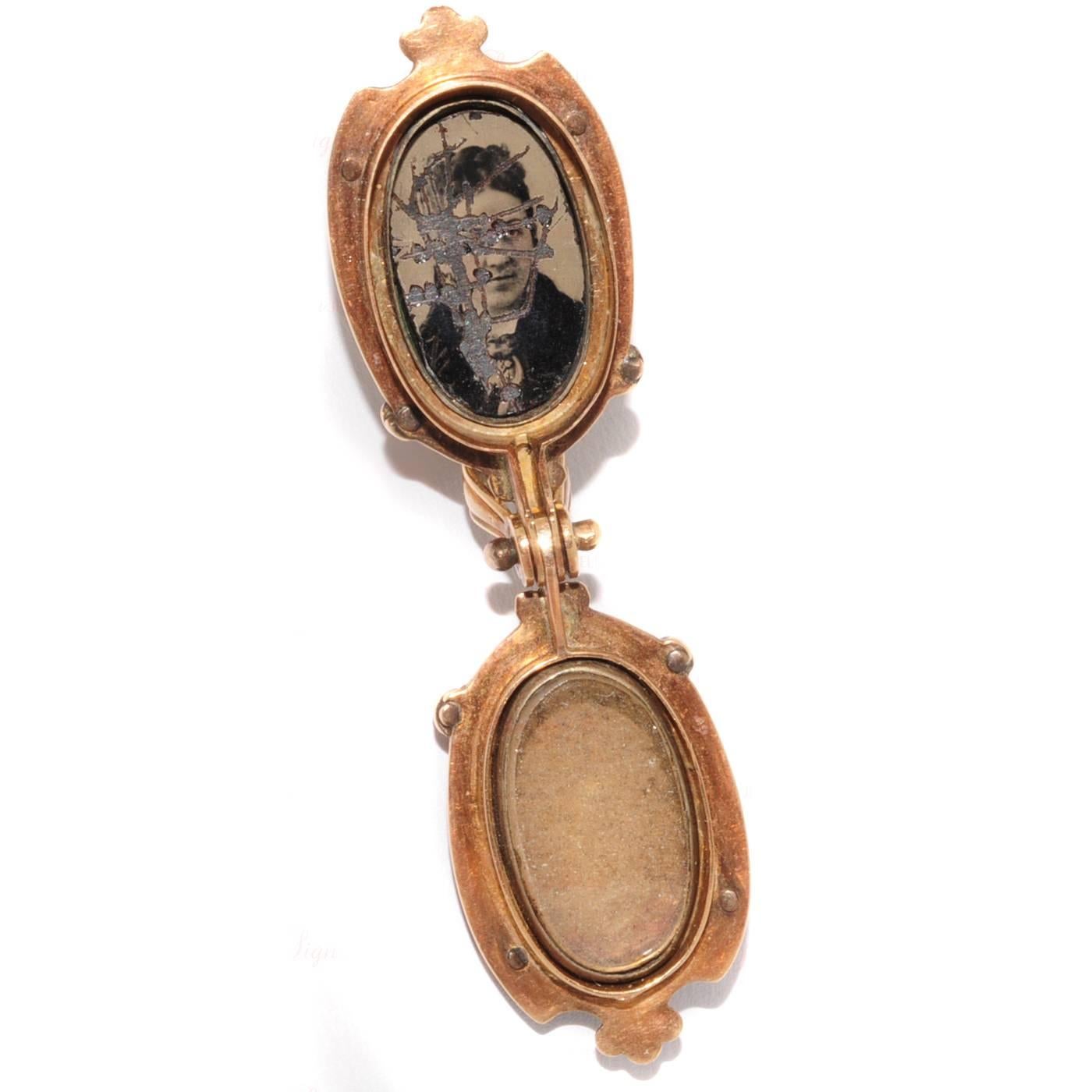 This antique ornate double-portrait locket was made in 1880s. It is crafted in 14k yellow gold and accented with light blue enamel to form a romantic floral design. Inside a locket is a scraped vernacular photograph of a man. Measurements: 0.74