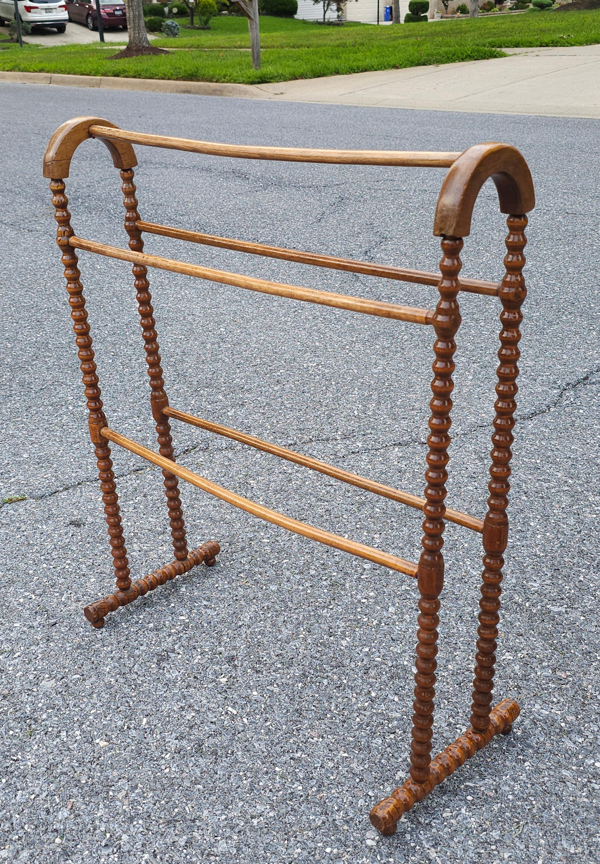 A Victorian Bobbin frame Mahogany Quilt Rack.  Measures 24