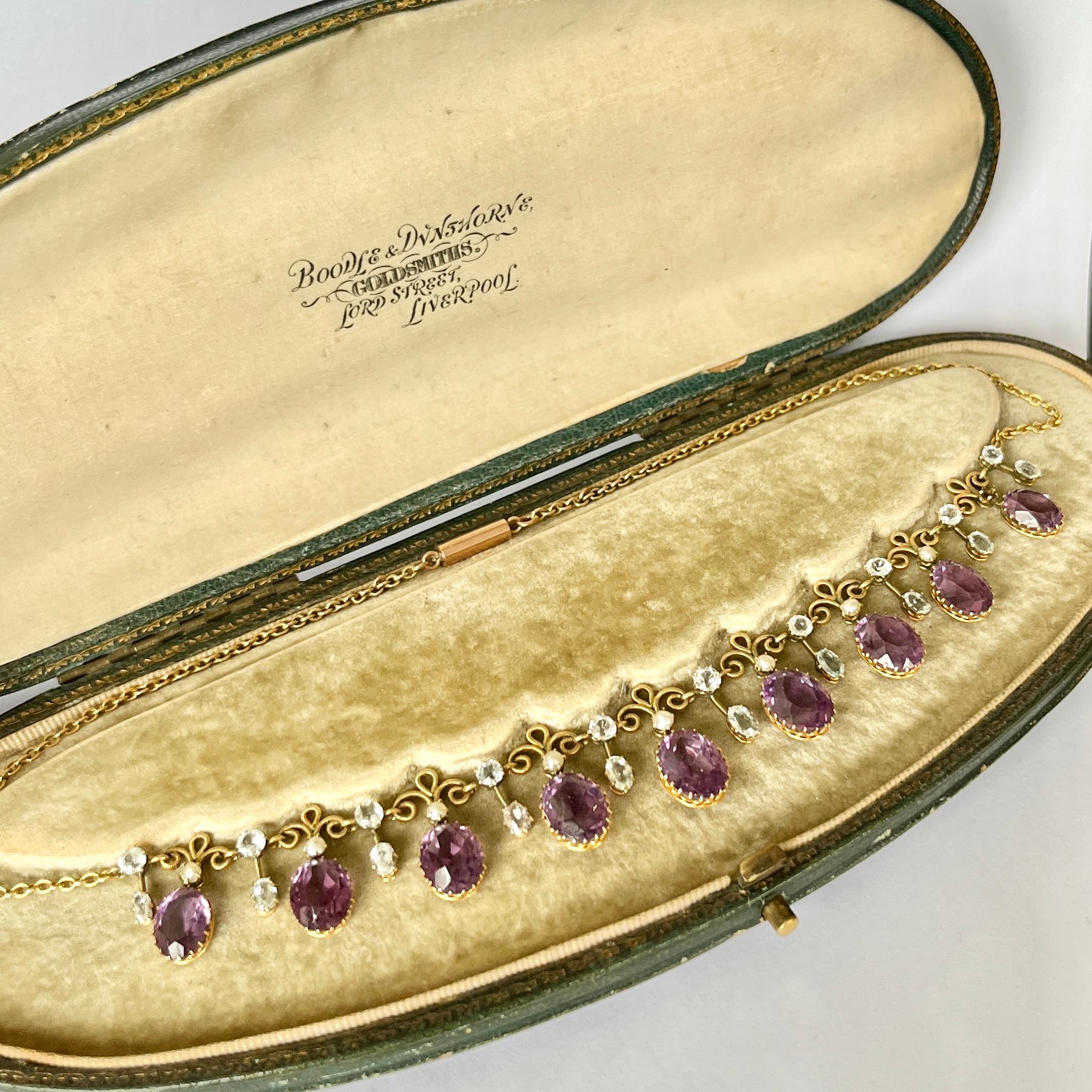 The amethyst stone are a gorgeous purple colour which sit beautifully in gold claw settings. The stones slightly graduate in size from the centre of the necklace to the fastening. In-between the stones is detailed gold work and there are drops set