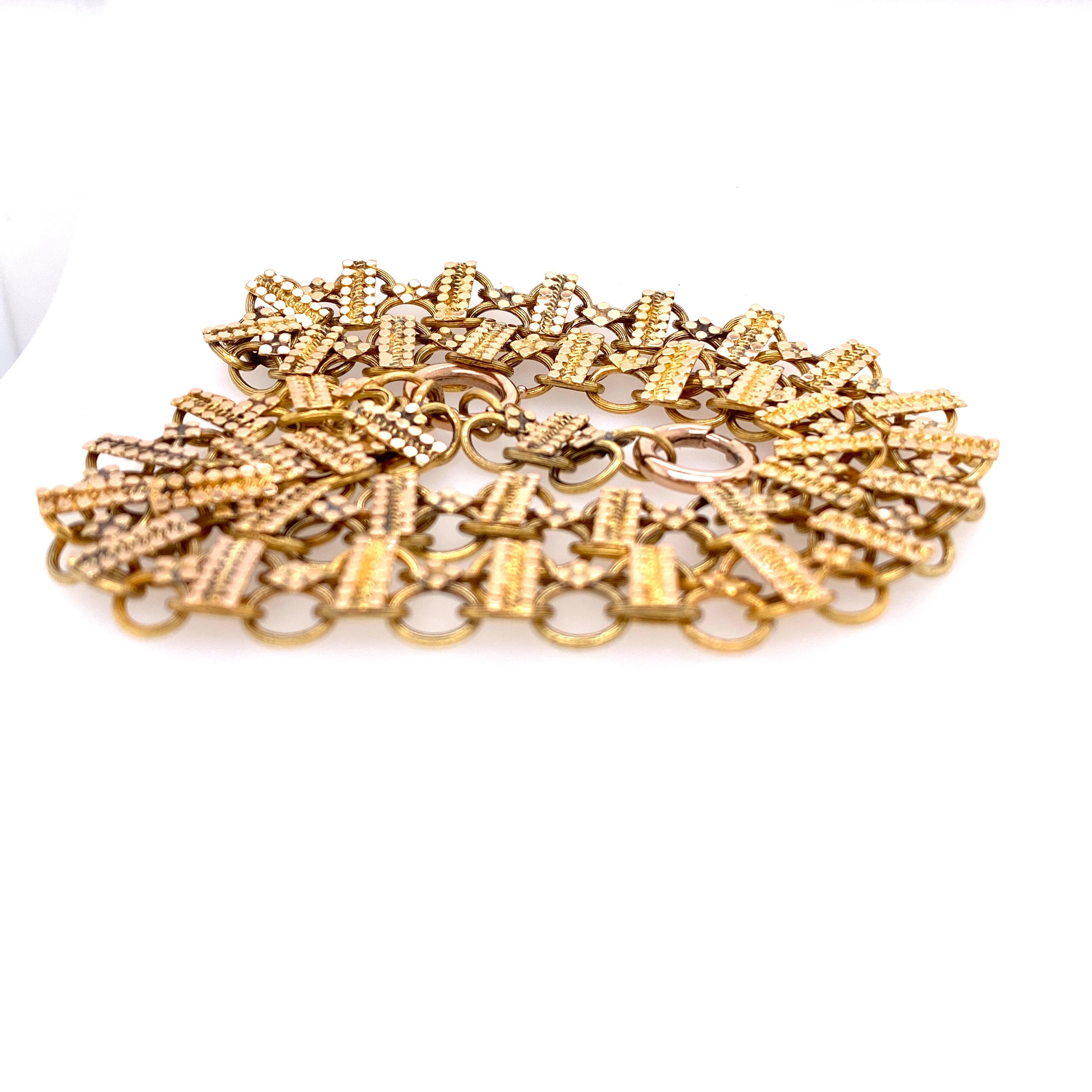 One 14 karat yellow gold (acid tested) 