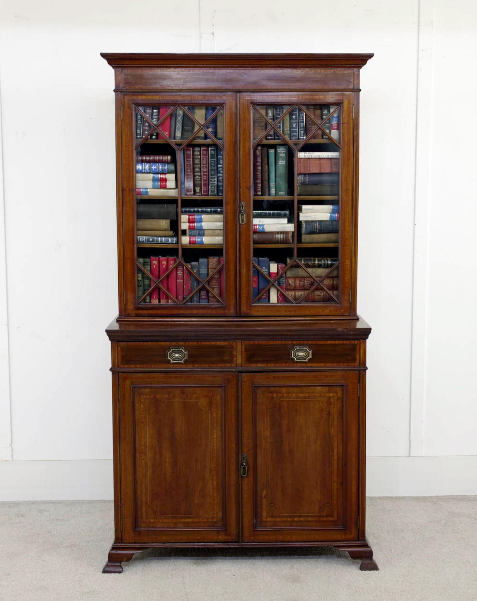 You are viewing a gorgeous Victorian library bookcase we date to circa 1890
Fine piece of period Victorian antique furniture
Gilt handles are original to piece
Doors open up to reveal shelved storage space
Top half comes from bottom so it can be