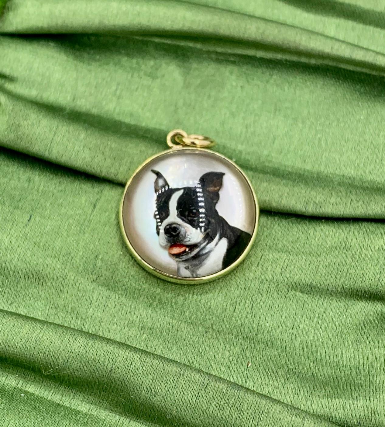 A gorgeous and very rare antique Victorian Essex Crystal, also referred to as a reverse crystal intaglio, Pendant with an exquisitely rendered carved and enamel image of a Boston Terrier or French Bulldog Dog in 14 Karat Gold.  The Essex Crystal