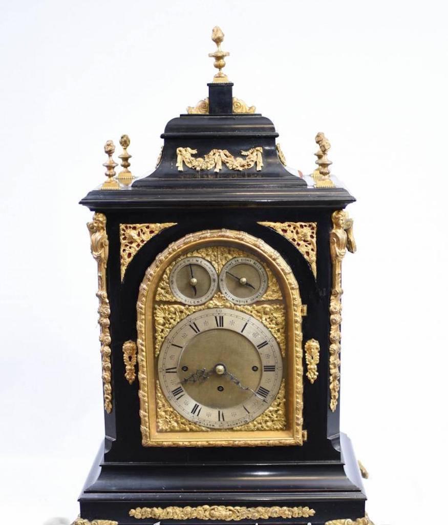 Victorian bracket clock, circa 1880 in an ebonised case with a silvered chapter ring displaying roman Numerals with two subsidiary dials to regulate the chiming mechanism and highly decorative face. The ormolu fittings are of the highest quality and