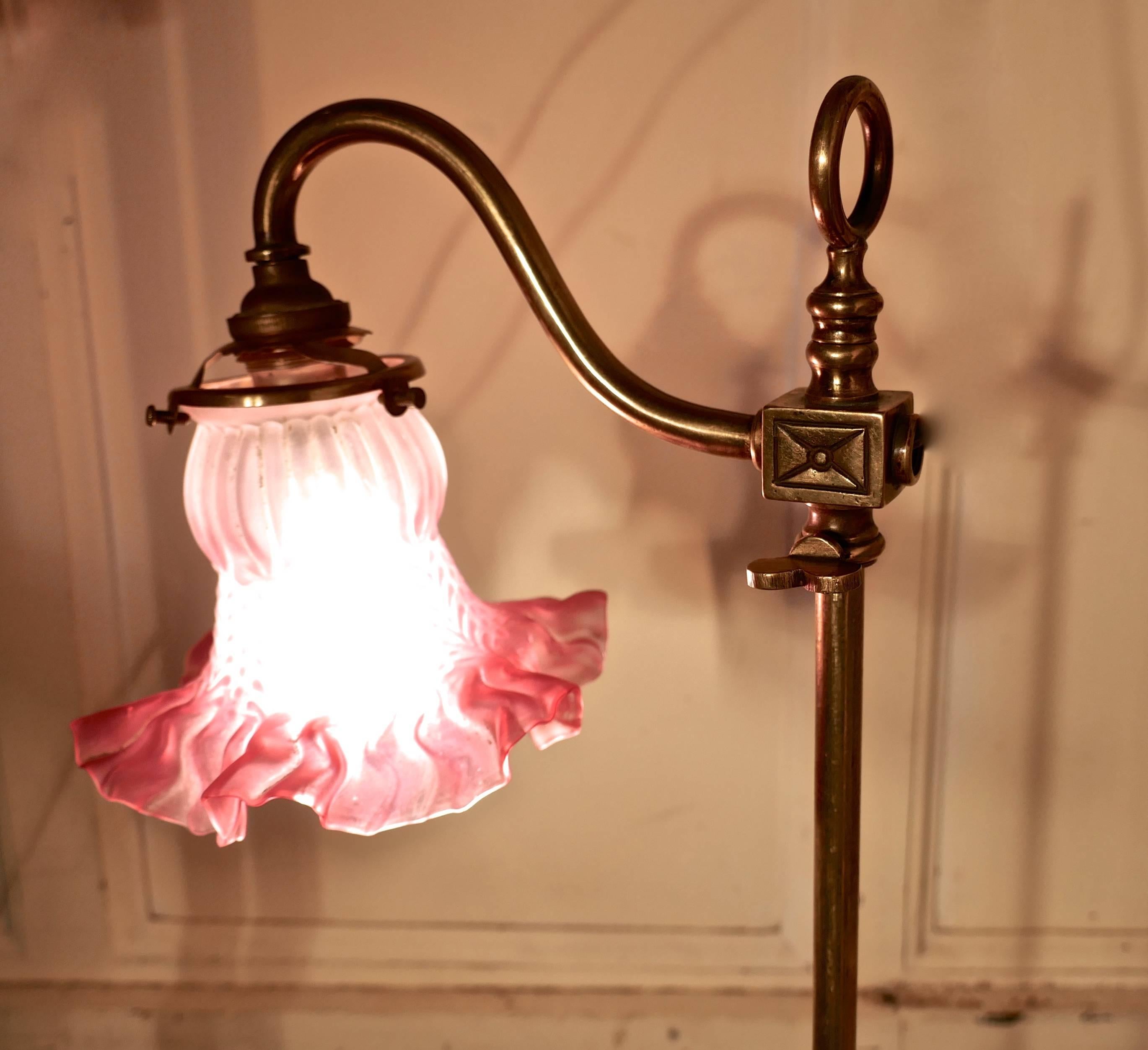 Victorian brass adjustable table lamp with rose pink shade


This is a very attractive piece, the lamp is very heavy, it has an embossed brass base and the central column supports a swan neck arm which can be raised and lowered, the lamp has been