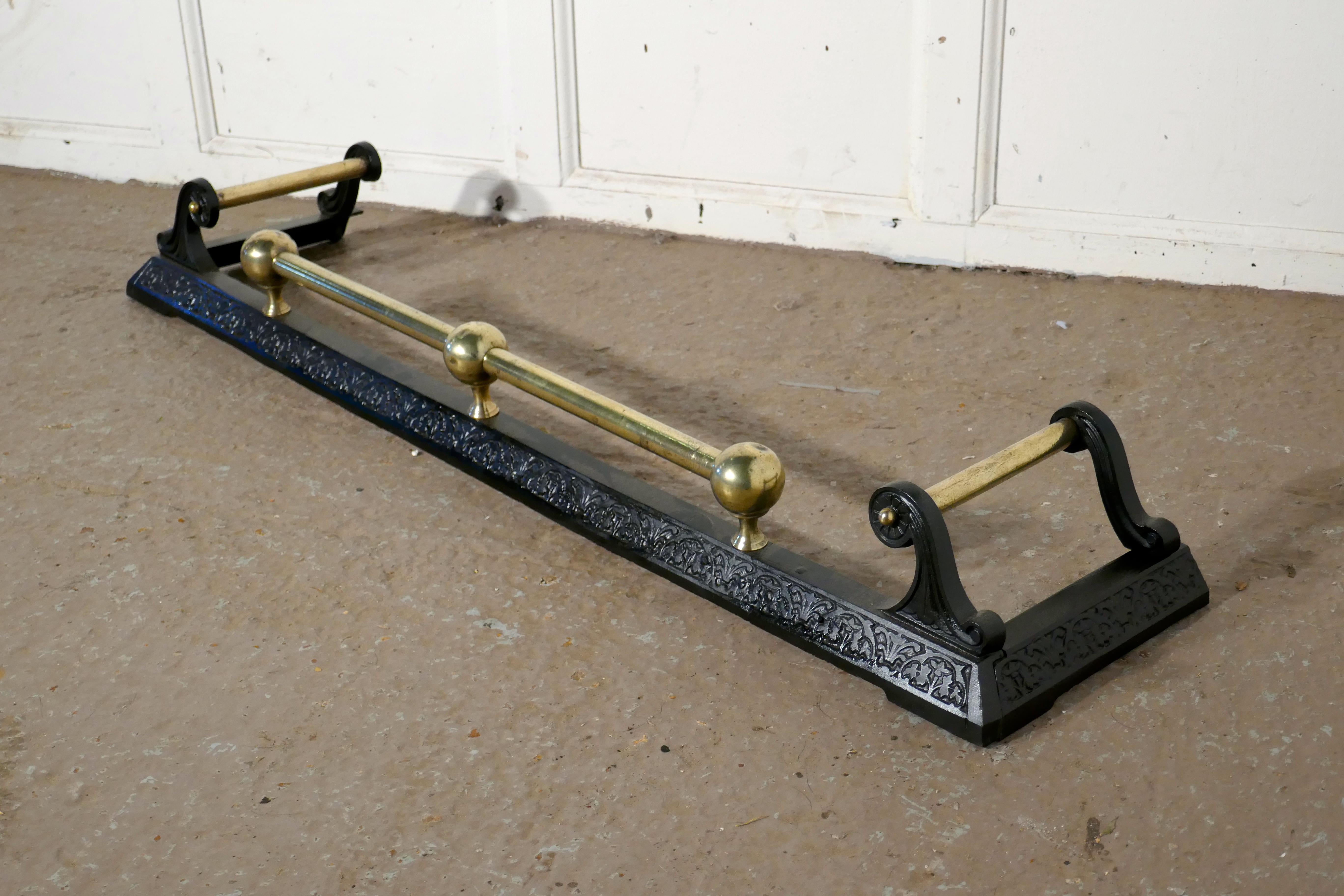 Victorian brass and iron fender

This is an attractive Victorian brass and iron fender it has decoration impressed on the iron base and the brass rail has chunky brass knobs supporting it
The fender is in very good condition it is 5” high, and