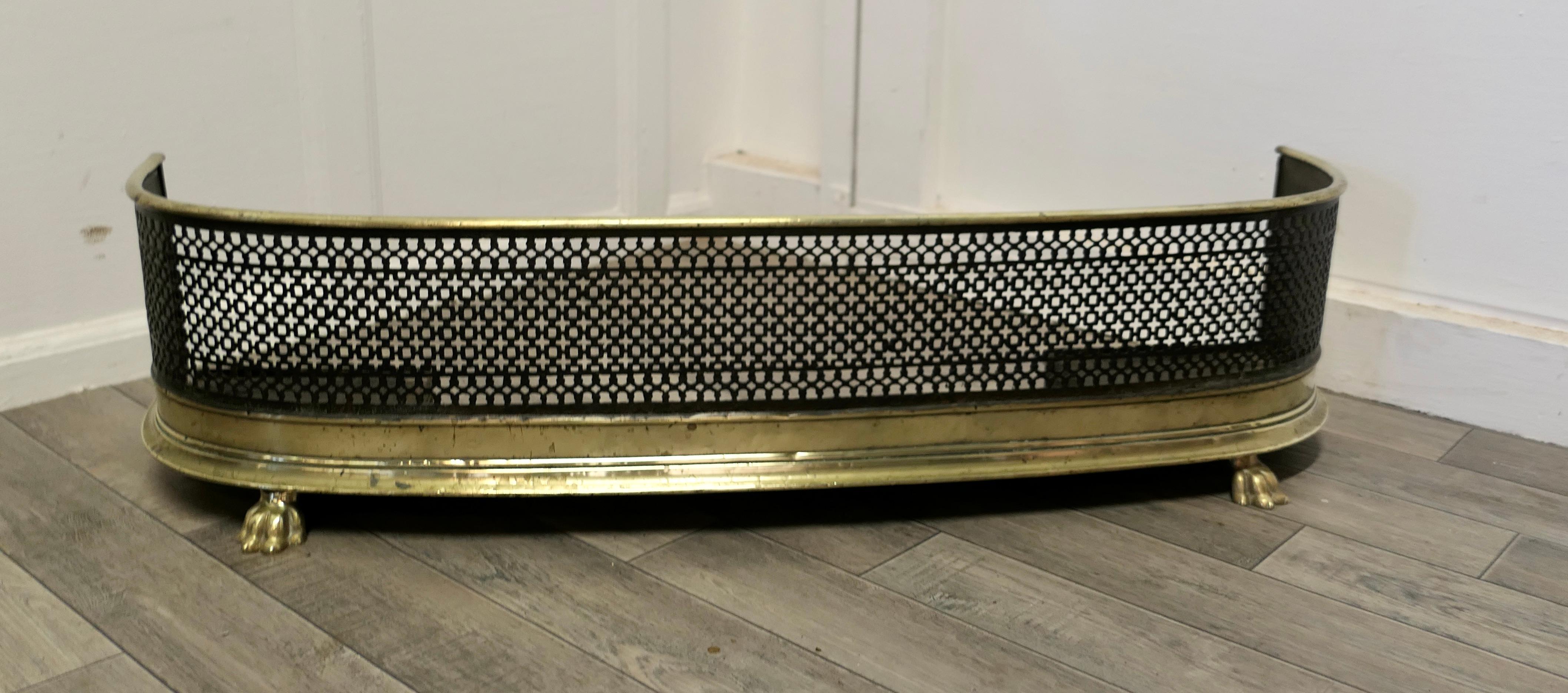 Victorian brass and iron Fireside Fender

A Beautiful slightly curved Victorian antique fender 
The fender has a slightly curved brass top rail, steel metal mesh and a deep brass base with decorative broad feet

The fender is in very good order