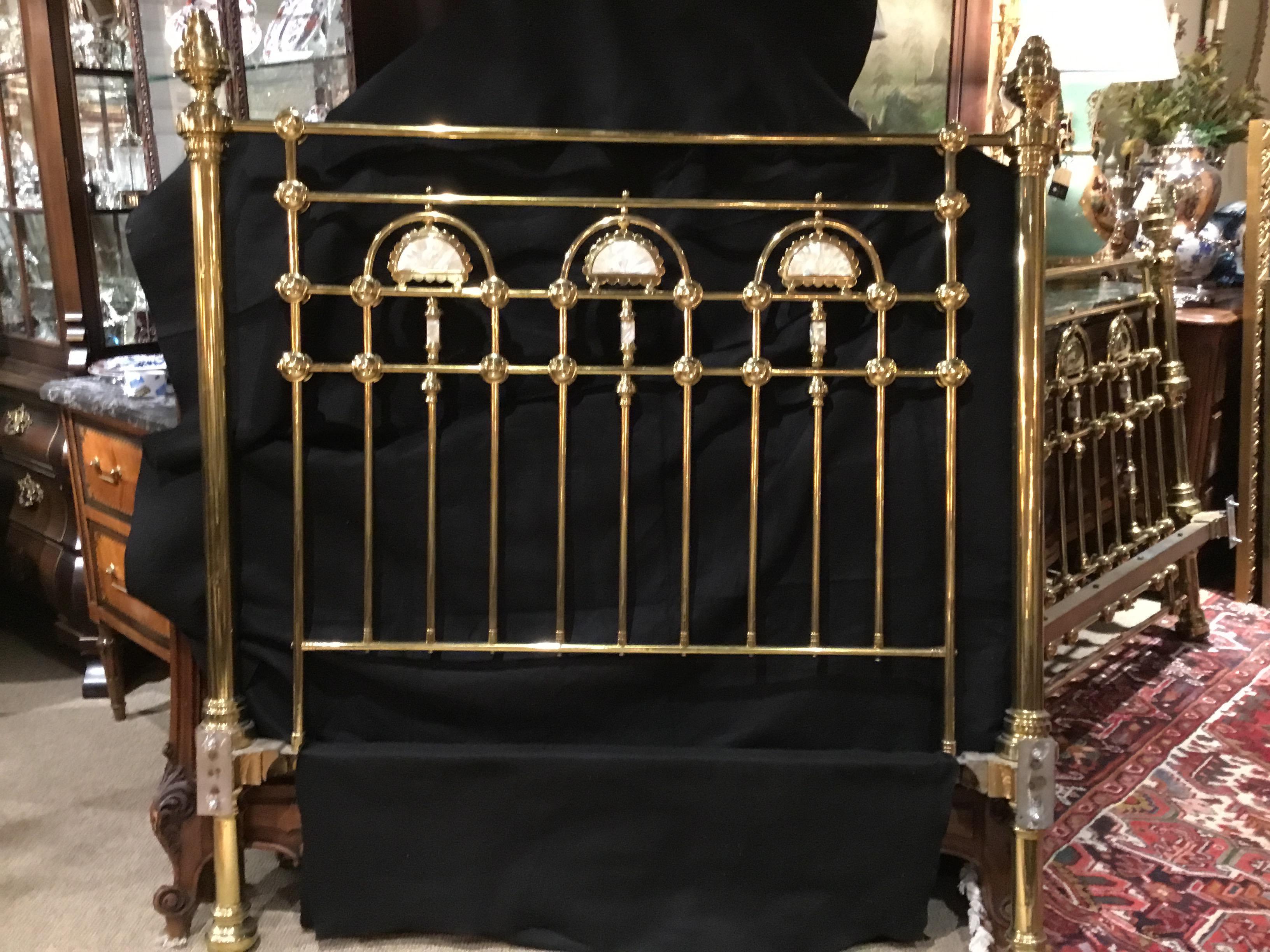 Brass bed with head board, foot board and rails. This is exceptional!
The mother of pearl inlay in fan shape makes this bed special.