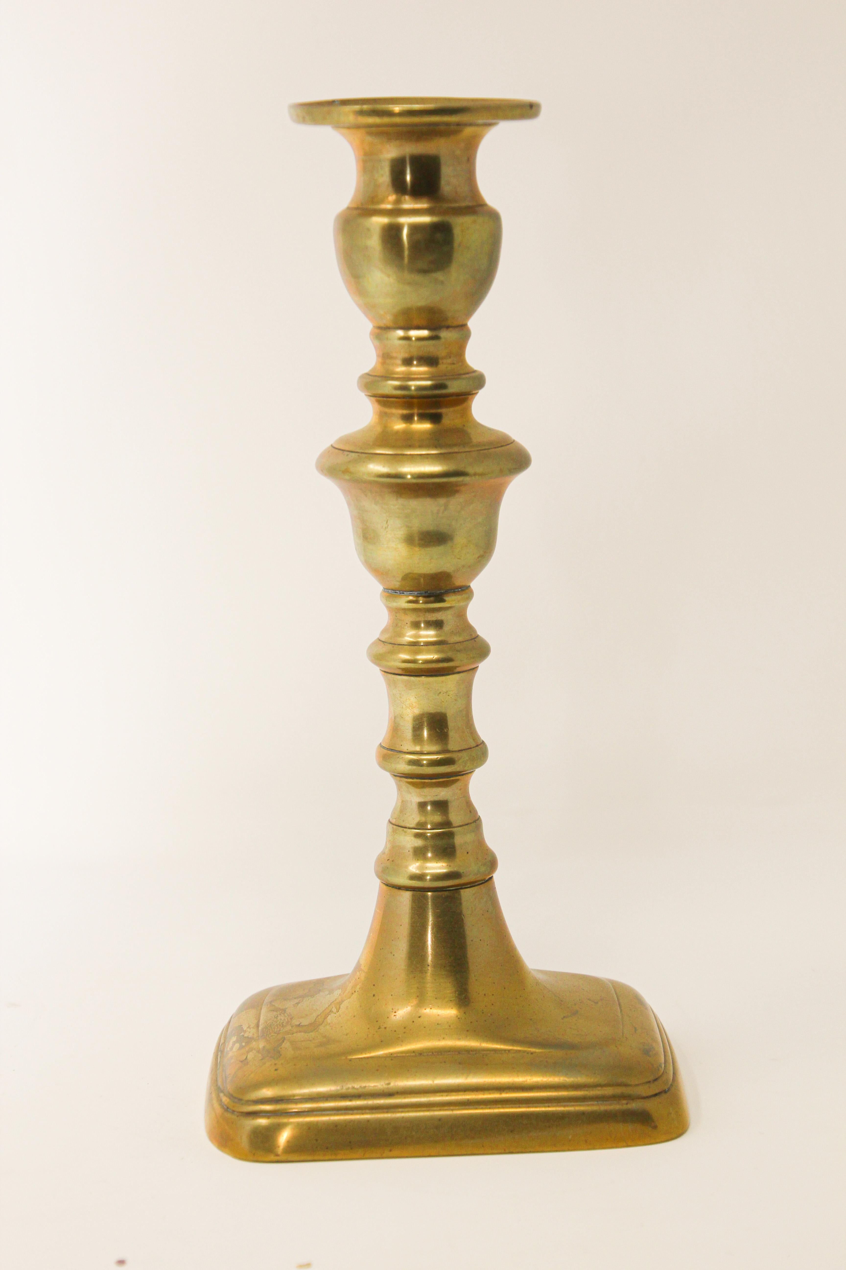 Victorian hand-tooled brass polished candlestick with a molded rectangular base.
Handcrafted Victorian brass candle stick, candleholder with push up.
Measures:
Base is 3.5