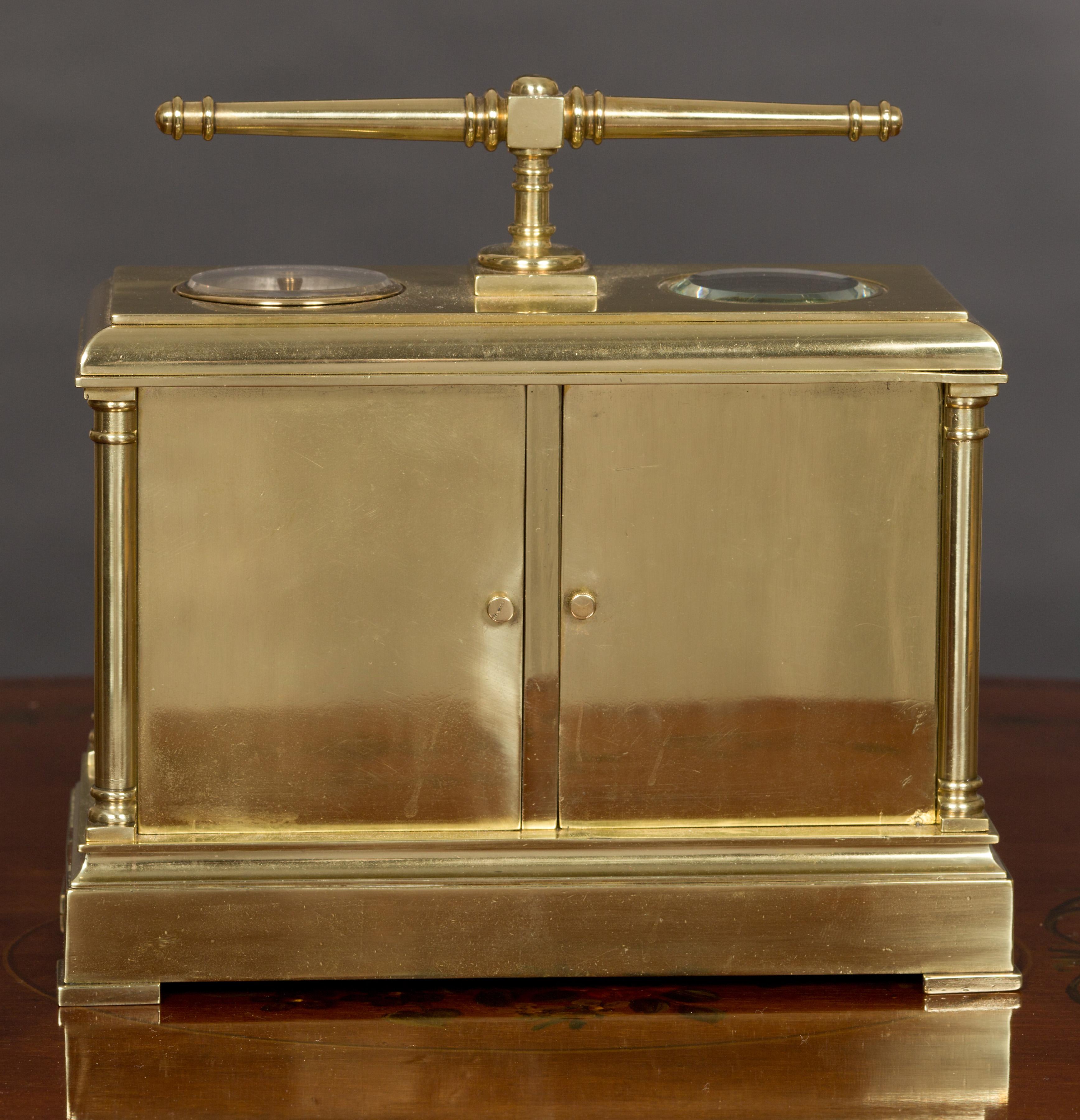 Late Victorian brass clock and barometer set with centrally mounted thermometer with enamel register plate.

The case stands on a raised plinth with pad feet, four brass pillars support the ‘cushion’ top surmounted by a turned and ringed brass