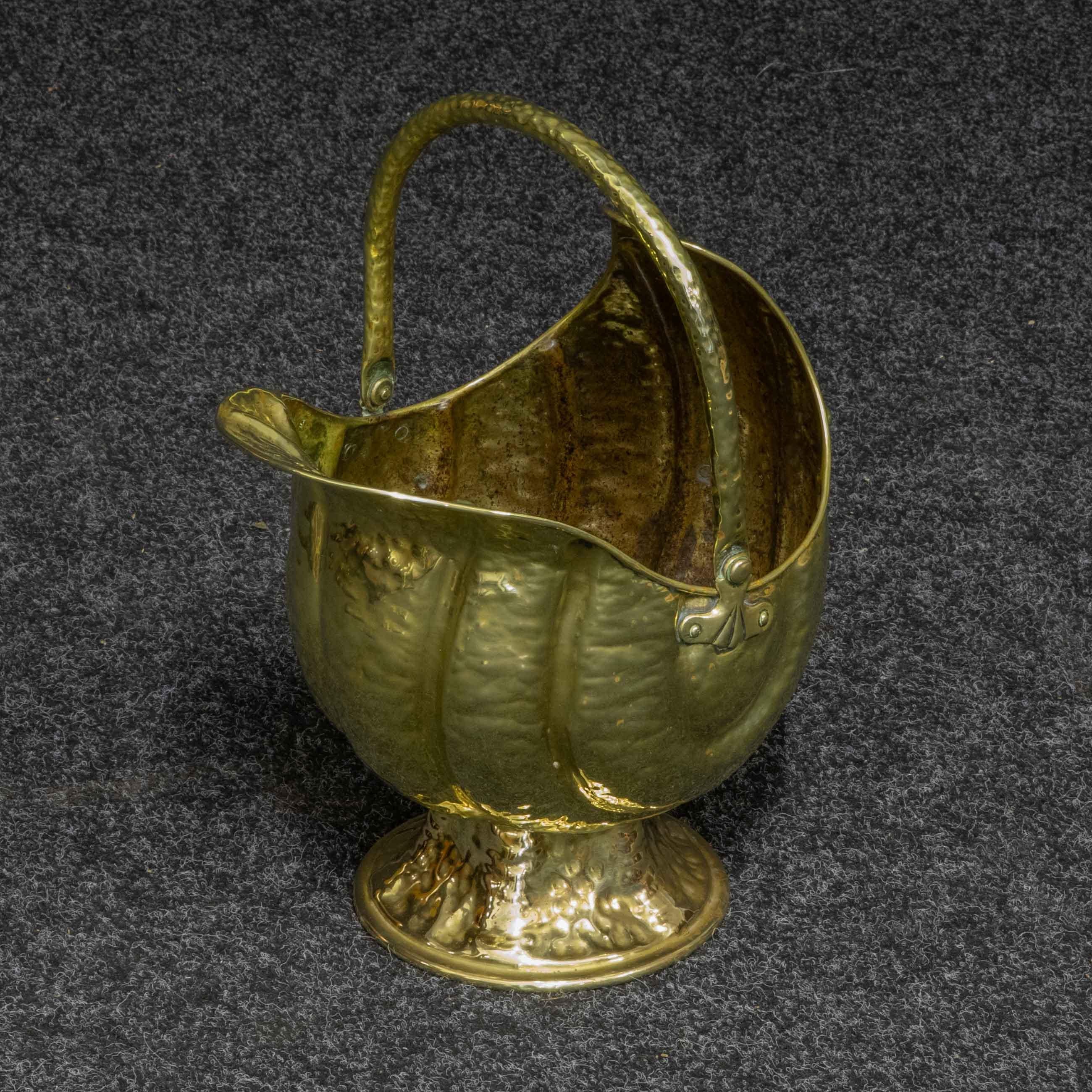 A fine and unusual brass coal helmet being of a 'Nautilus' shell shape. Quite possibly originating from a coastal environment. All hand beaten brasswork to give the shell effect. In good condition, cleaned and polished ready to use.
 