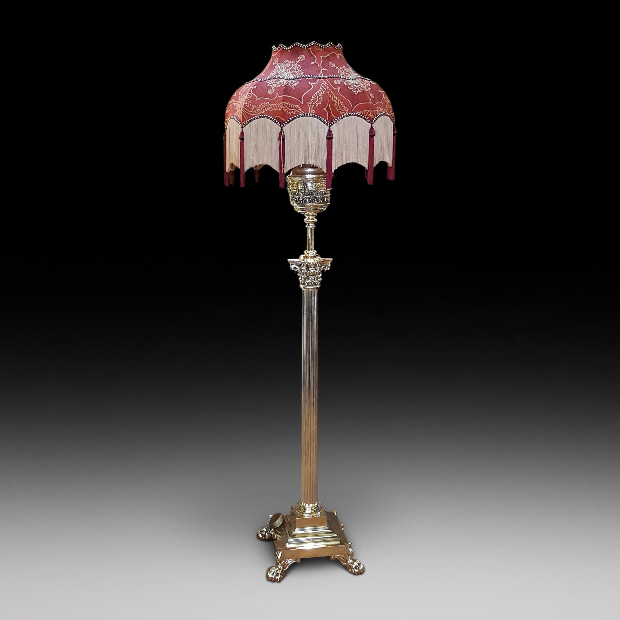 Victorian brass extending telescopic standard oil lamp by messenger with substantial corinthian column, stepped platform base on lion paw feet - converted to electric.
The lampshade(s) are newly handmade silks by the same maker as provides the