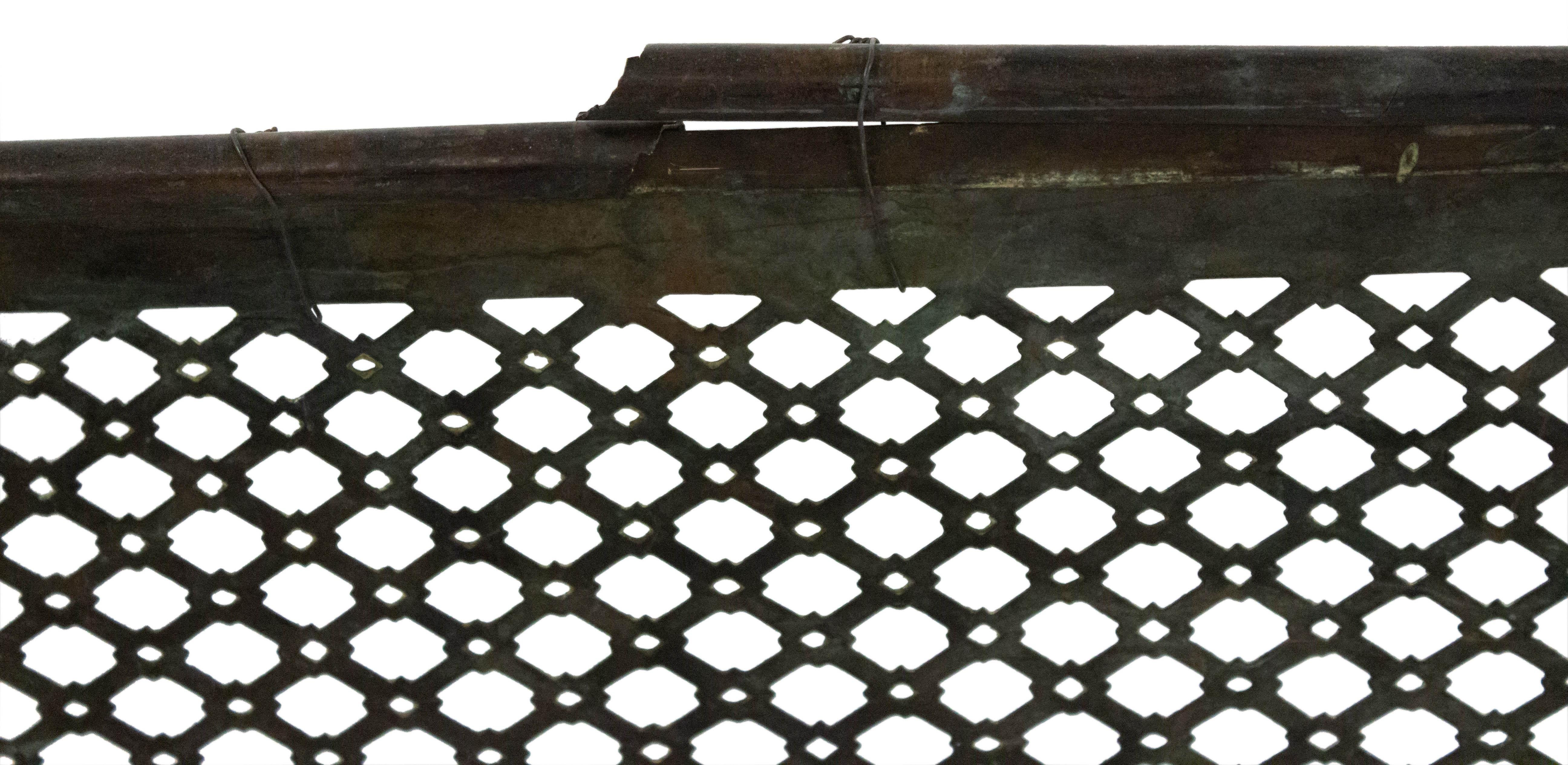 English (20th Century) brass perforated fire fender.
  