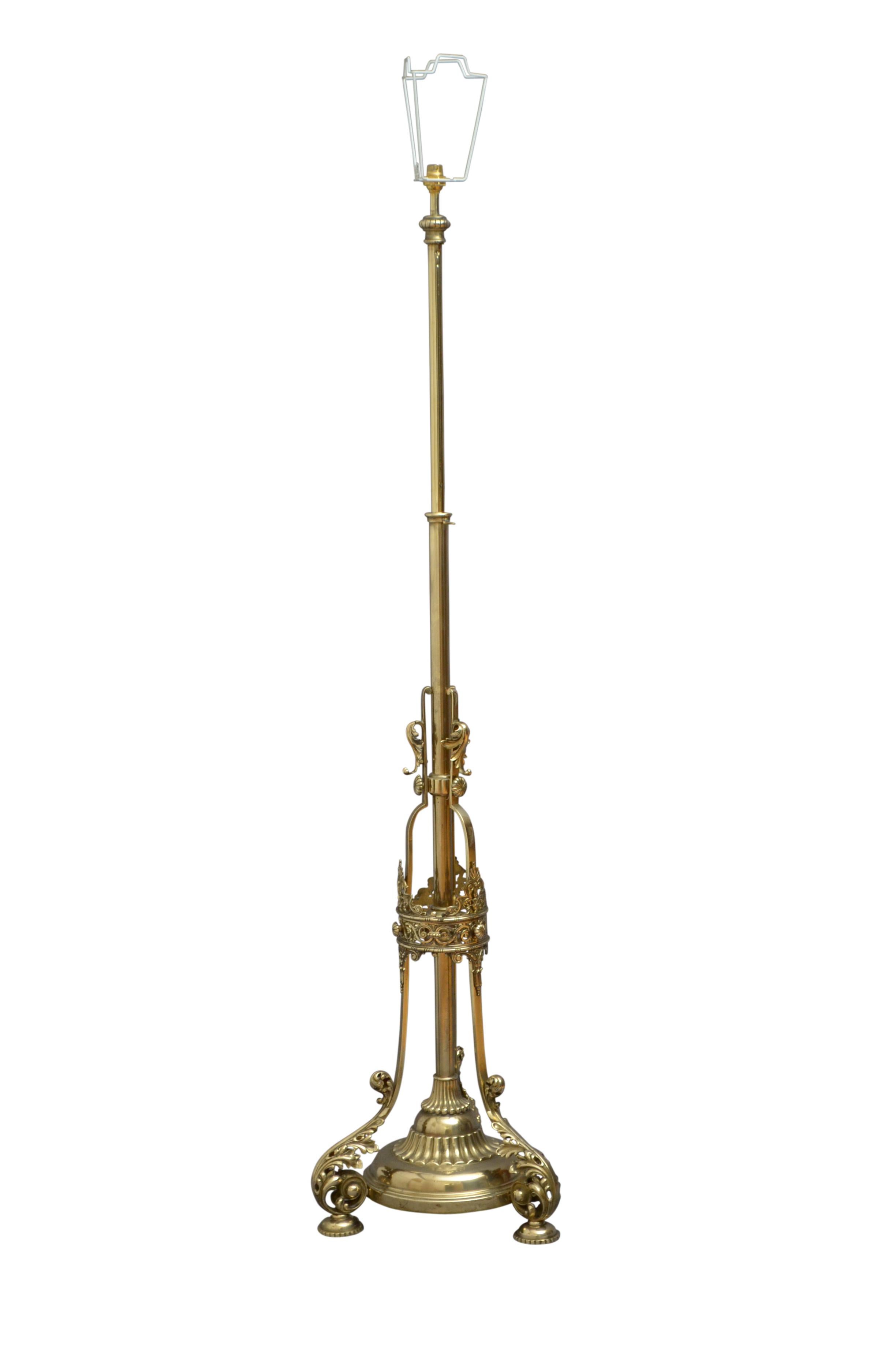Outstanding Victorian height adjustable standard lamp, having extending column terminating in fluted circular base supported on three beautifully decorated uprights with acanthus leaves united by fretwork crown, all standing on leafy scrolls