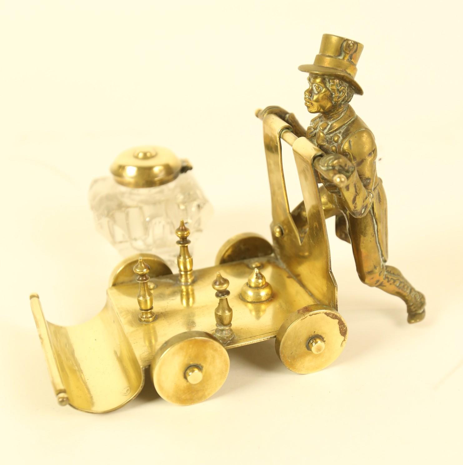 Late Victorian Victorian Brass ink stand  in the form of a  Gentleman Pushing a cart For Sale