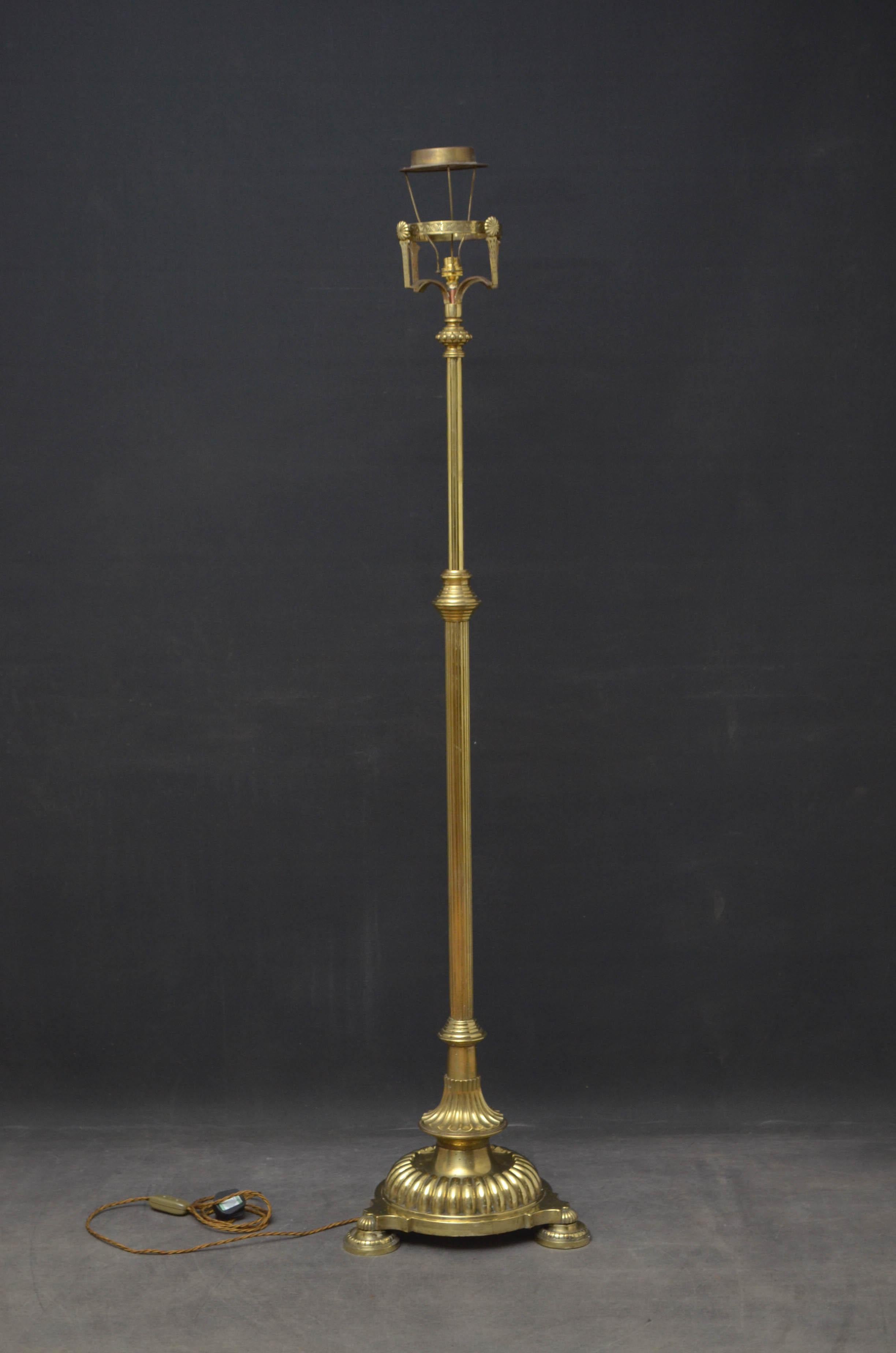 Sn4468 Victorian brass, height adjustable standard lamp, having cylindrical column rising from embossed base which terminates in 3 pad feet. This antique lamp has been rewired and PET tested. Lampshade not included, circa 1880
Measures: H 49-62