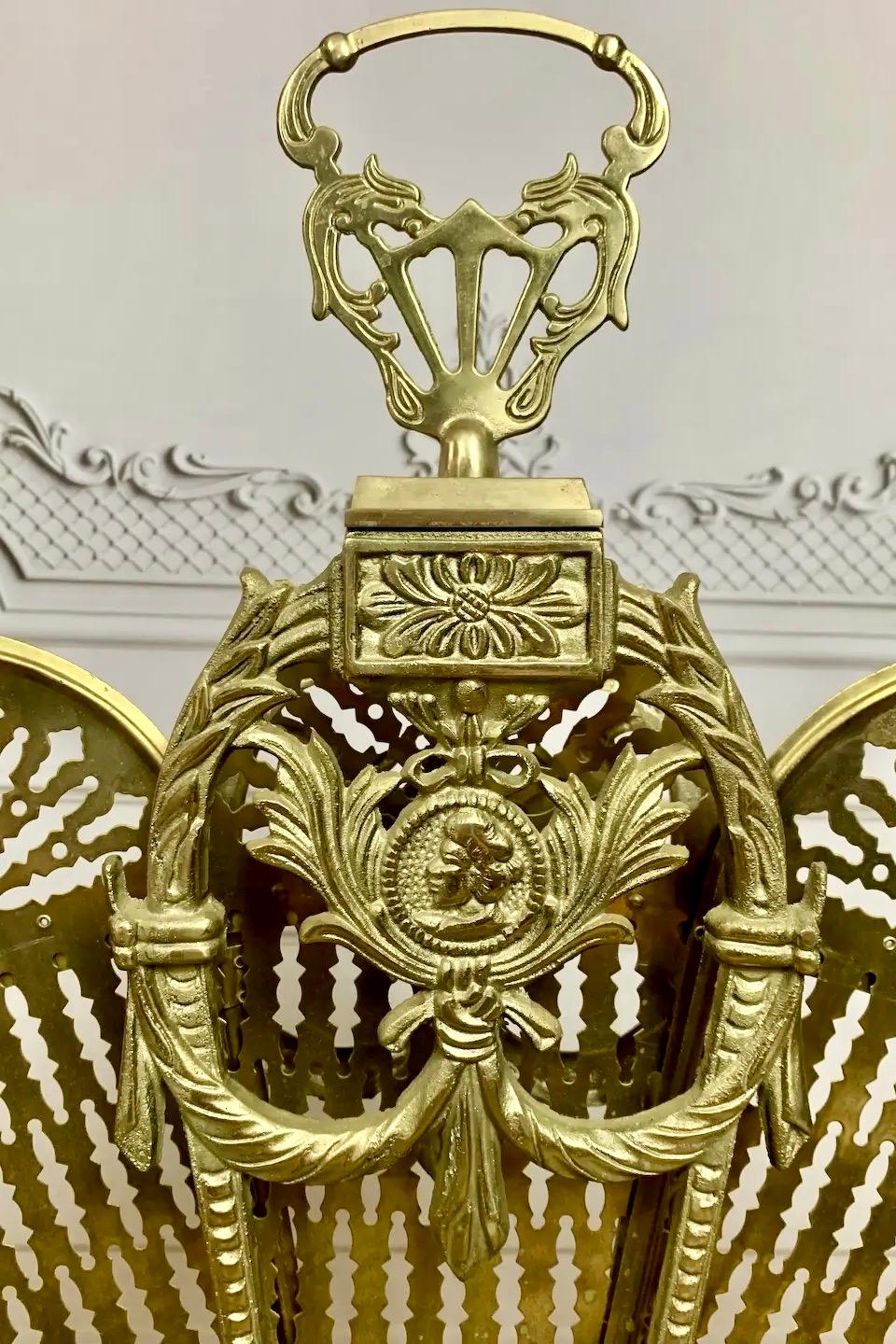 Ornate Victorian peacock fireplace screen circa 1890-1910. An elegant accent piece to complement the hearth in any season that incorporates a stylized element of sophistication to your home décor. Featuring a traditional cameo design, representative