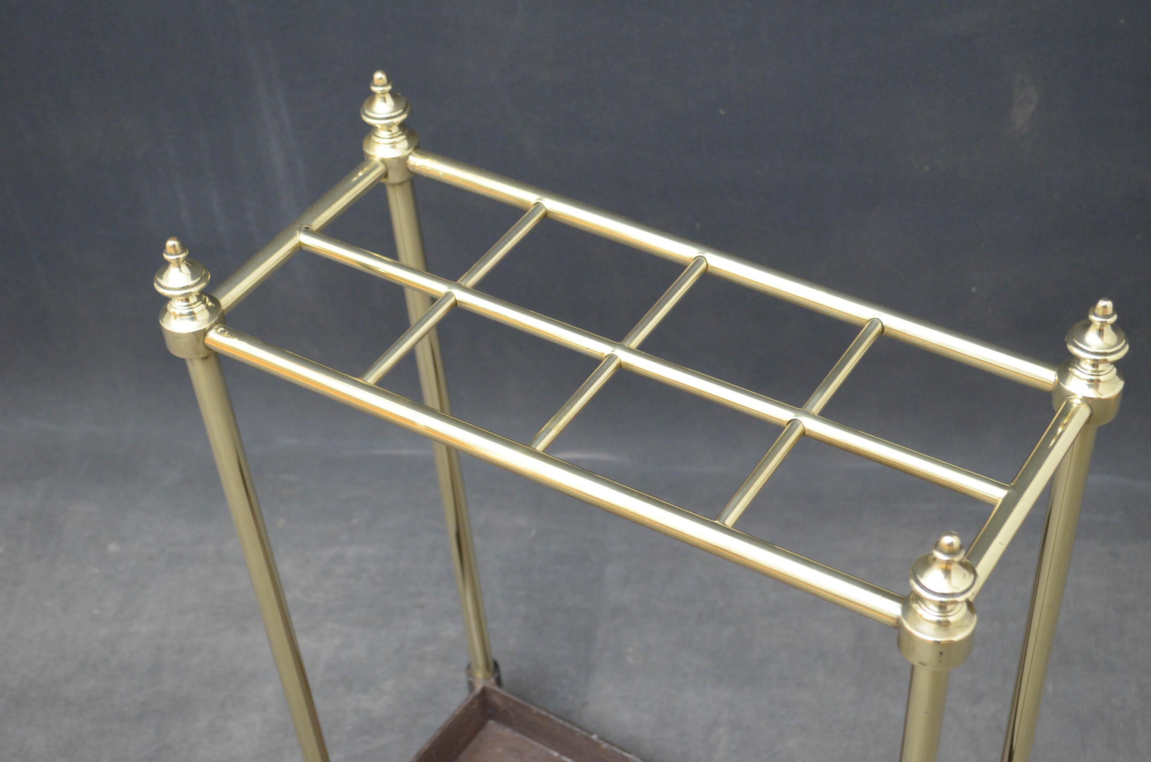 Sn4832, a Victorian brass umbrella stand / stick stand, having 8 sections for umbrellas and walking sticks with finials and cast iron drip tray, all in fantastic condition throughout, ready to place at home, circa 1880
Measures: H 26