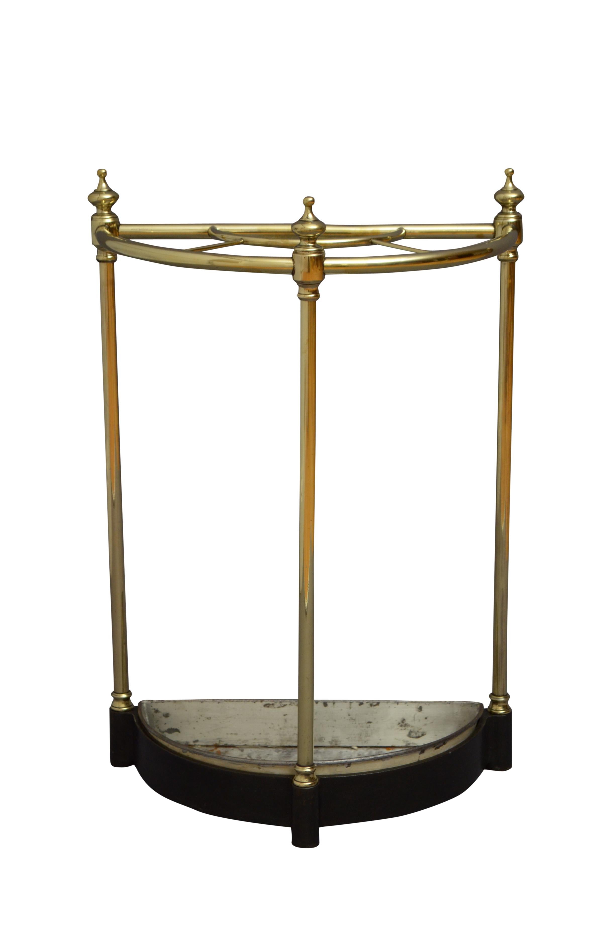 K0168 Victorian brass umbrella stand of half moon outlie with three finials, removable drip tray and cast iron base. This walking sticks Stand / umbrella Stand has been cleaned and polished and it is in home ready condition. c1880
Measures: H24.5