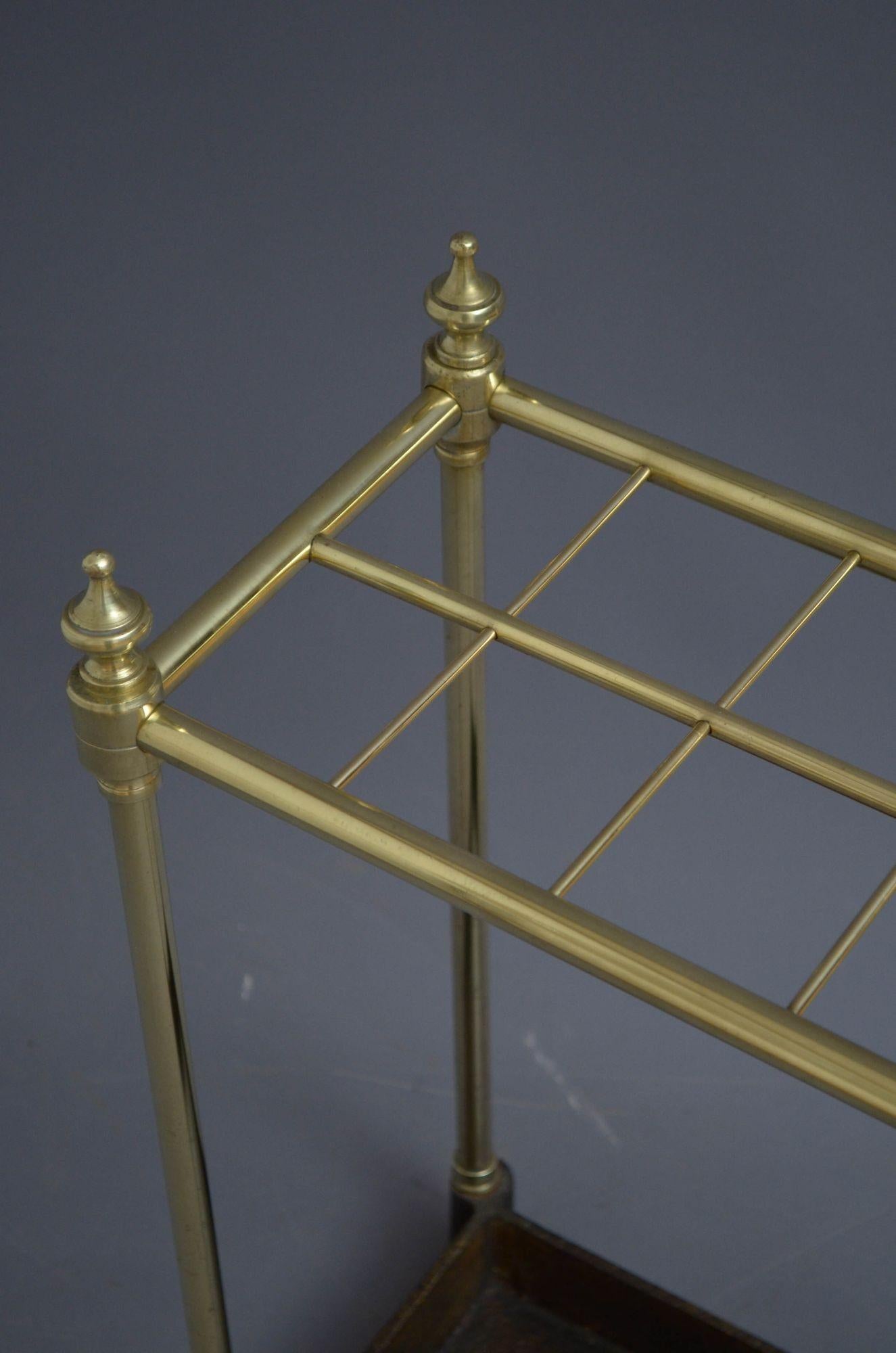 Sn5345 Victorian brass umbrella stand / stick stand with eight divisions, decorative finials and cast iron drip tray, all in home ready condition. c1880
H22.5