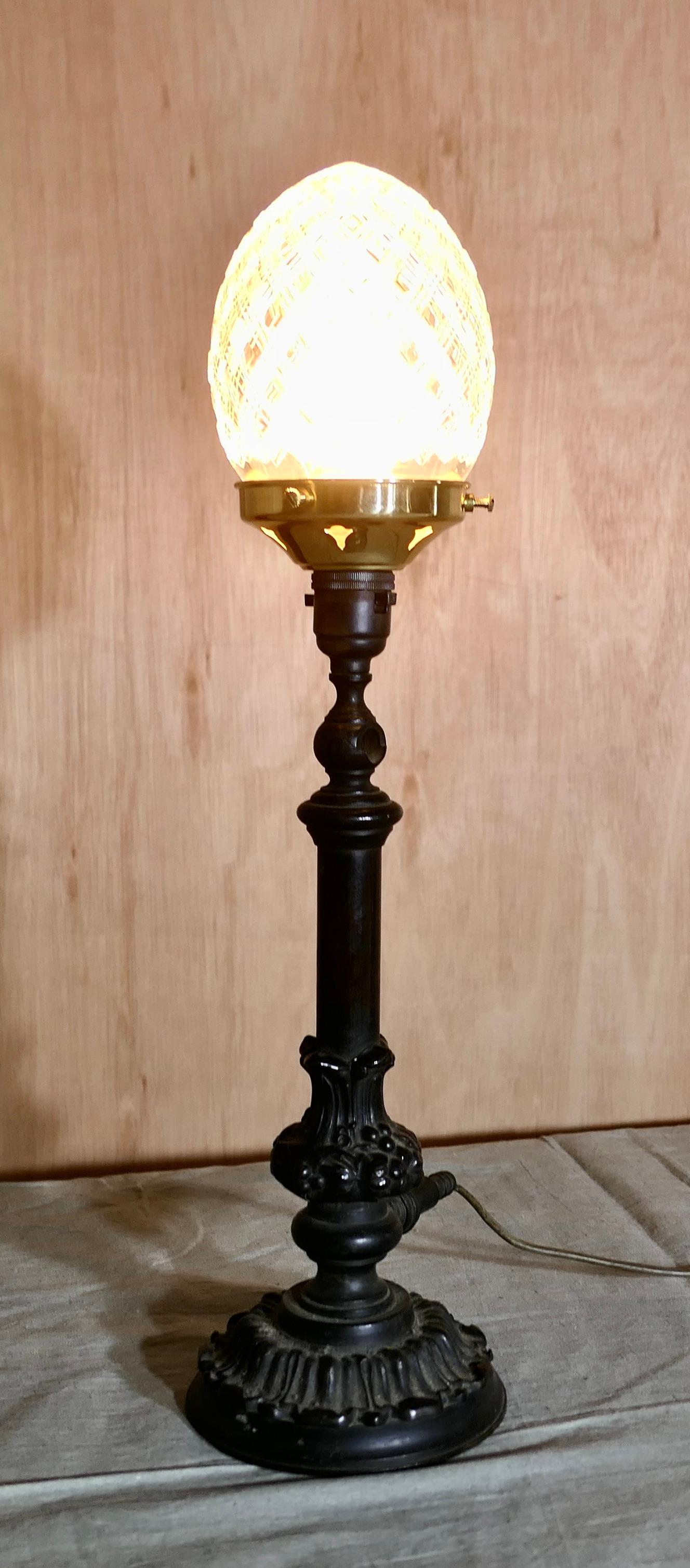 Victorian Bronze Lamp with Diamond Cut Crystal Shade

A Charming bronze lamp, the lamp has been converted from an original gas light, it has been set with a diamond cut crystal shade to finish it off
The lamp is fully working, and the wiring is