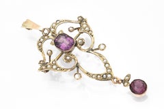 Victorian brooch pendant with amethysts and pearls, England, circa 1900.
