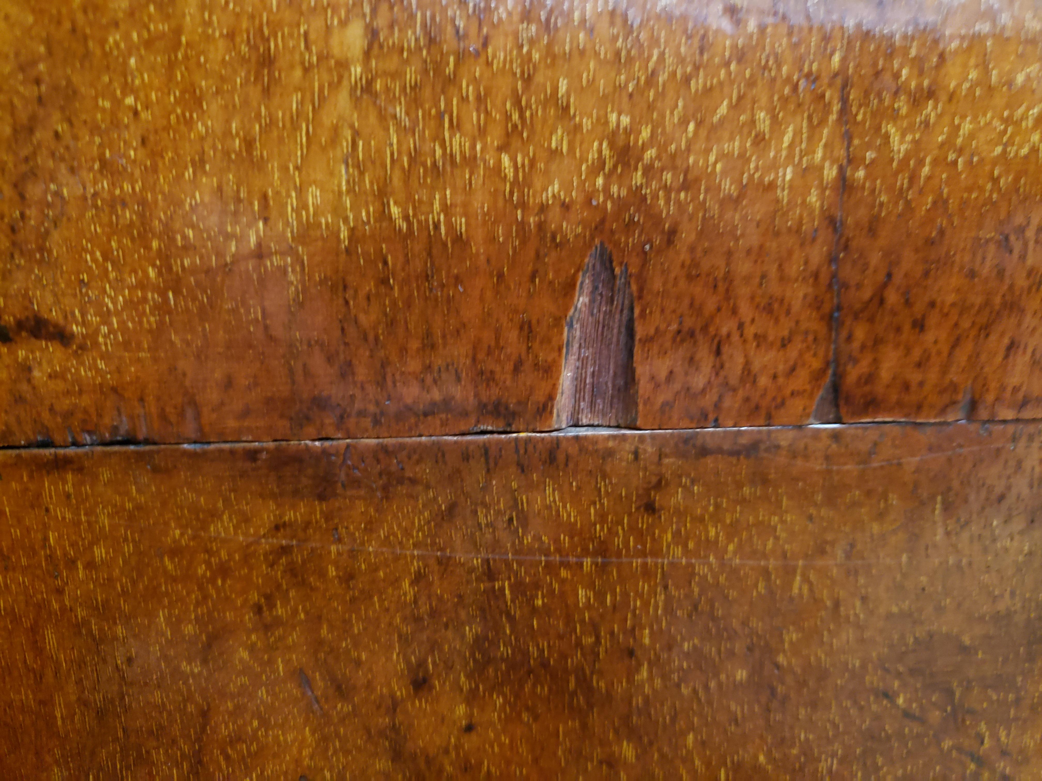 Victorian burl walnut and mahogany top campaign chest. This piece features a central drawer enclosing a hinged leather writing surface and various storage compartments with sliding lids. The top and sides of this chest are mahogany. This chest has