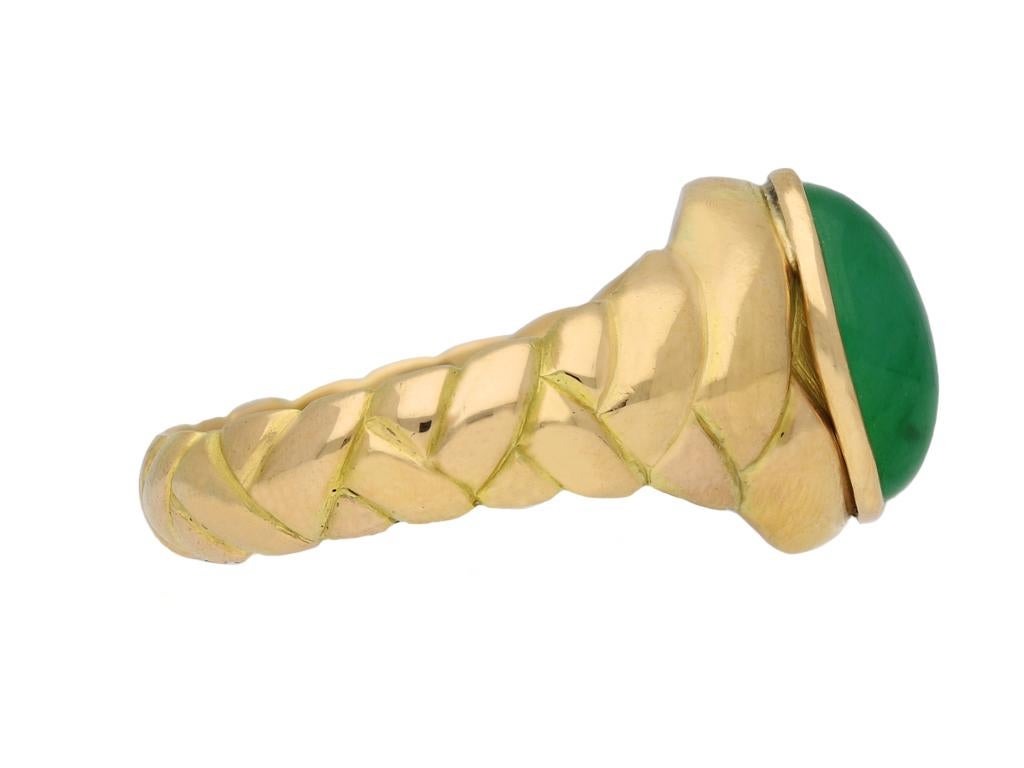 Victorian Burmese jade locket ring. Set to centre with an oval cabochon natural unenhanced Burmese jade in an openback rubover setting with an approximate weight of 4.00 carats, to a heavy twisted solitaire design, featuring polished edges, a