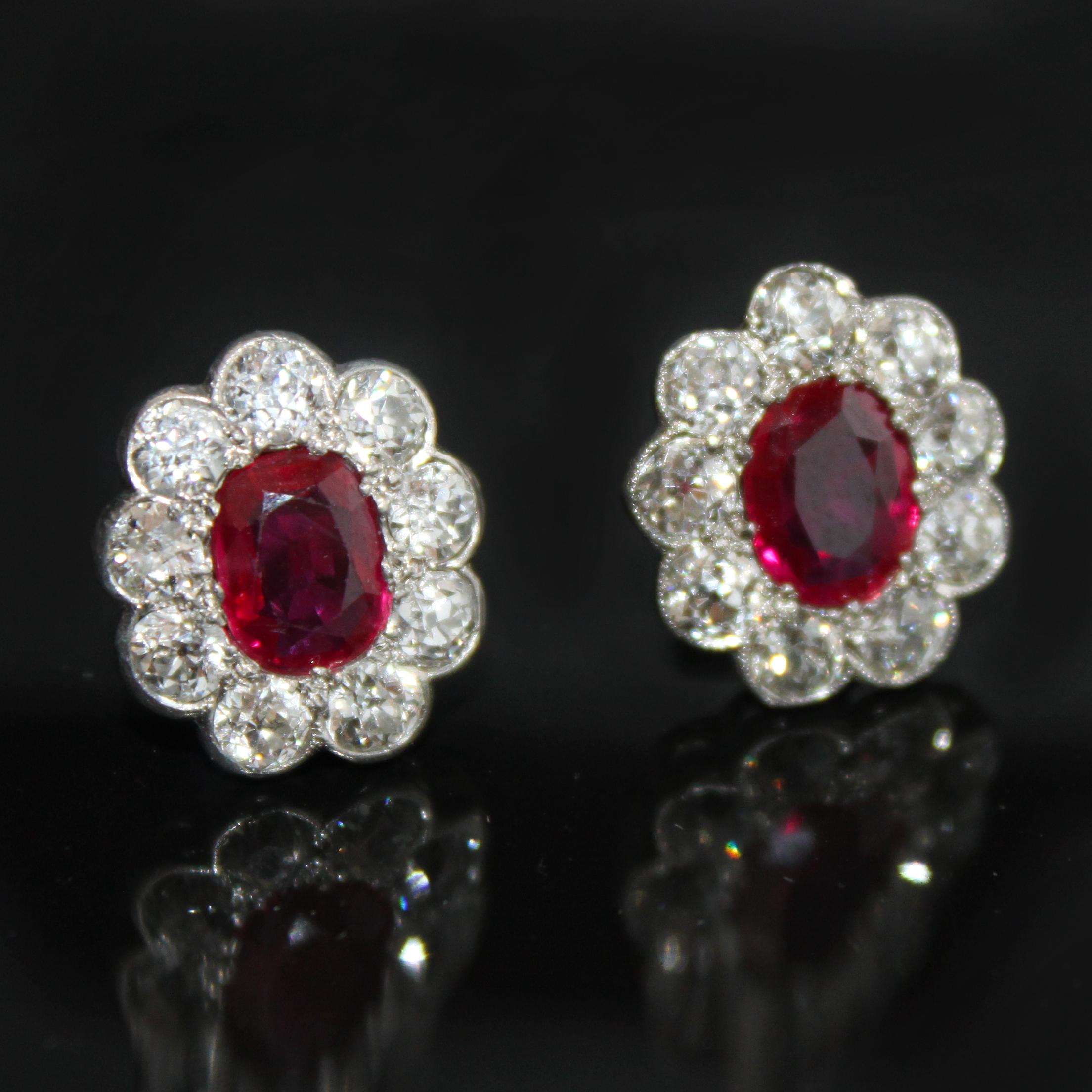 A pair of Edwardian ruby and diamond cluster earrings, ca. 1910s. The rubies are of Burmese (Myanmar) origin and natural (not heat treated), weighing approximately 2.5 carats - accompanied by a DSEF gemological certificate. They are a very fine and