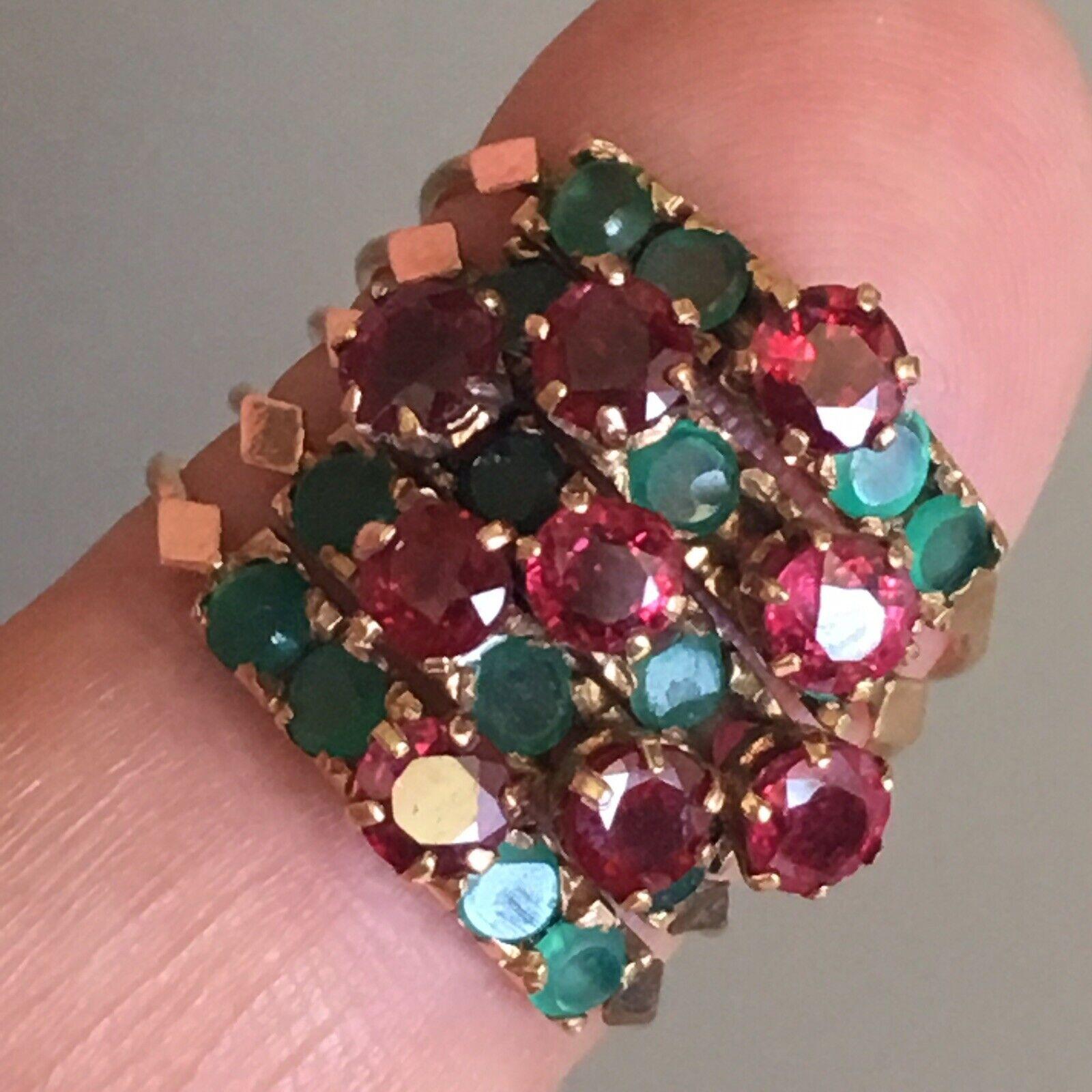 Victorian hallmarked circa 1880s gold Antique Multi Band ring
Burmese Ruby & Emerald
9 pieces of 4 mm natural round Burmese Rubies and 16 pieces of round 2.5 mm natural Emeralds
weighting 6.3 gram finger size 6 1/2

In perfect condition considering