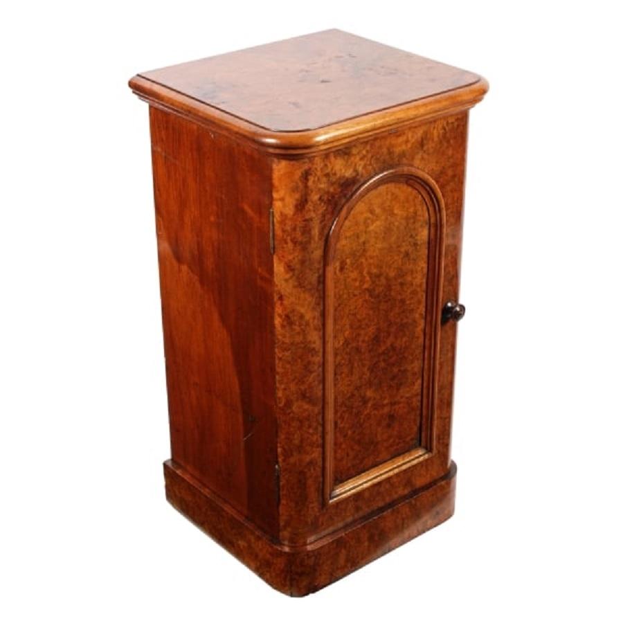 A middle of the 19th century Victorian burr walnut veneered bedside cabinet.

The cabinet has a left hand opening door, a rounded edge to the top and a moulded frame.

The door has an original ball catch fastening and the interior has a single