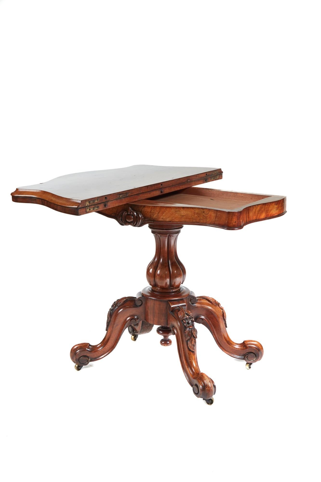 A good quality antique Victorian burr walnut serpentine shaped card table having a swivel top, green baize interior, serpentine carved frieze, shaped reeded column supported by four carved shaped cabriole legs on original castors.
   