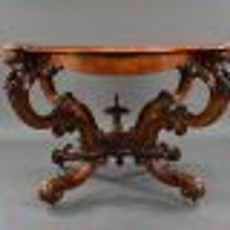 For sale is a fine quality Victorian burr walnut and marquetry inlaid table. The top is ornately shaped and has scrolling leaf inlay to the edge, this is supported by four intricately shaped and carved legs with a finial in the centre. This table is