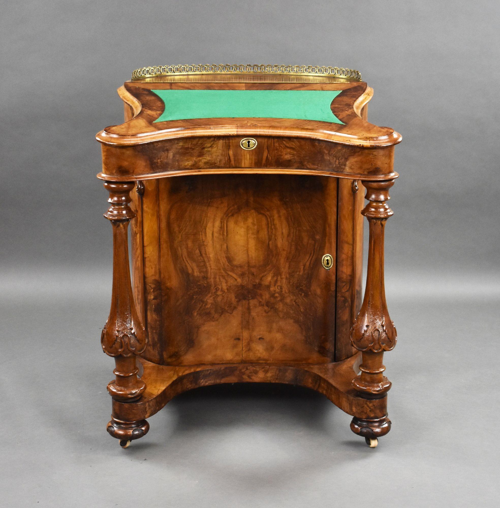 For sale is a good quality Victorian burr walnut davenport, of unusual form, having a brass galleried top, above a green baise writing surface, with a hinged fall opening to an interior fitted with three faux drawers and pigeon holes. The top is