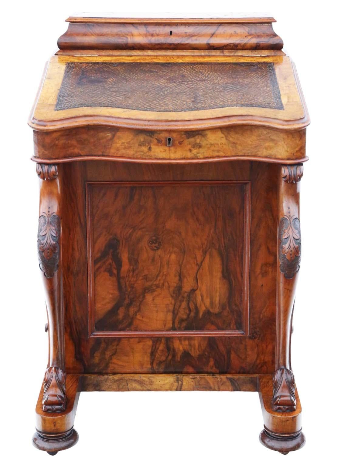 Presenting an exquisite Victorian Burr and Figured Walnut Davenport Writing Table Desk dating back to approximately 1870. This charming piece exudes age and character, making it a rare and sought-after find for antique enthusiasts.

Featuring period