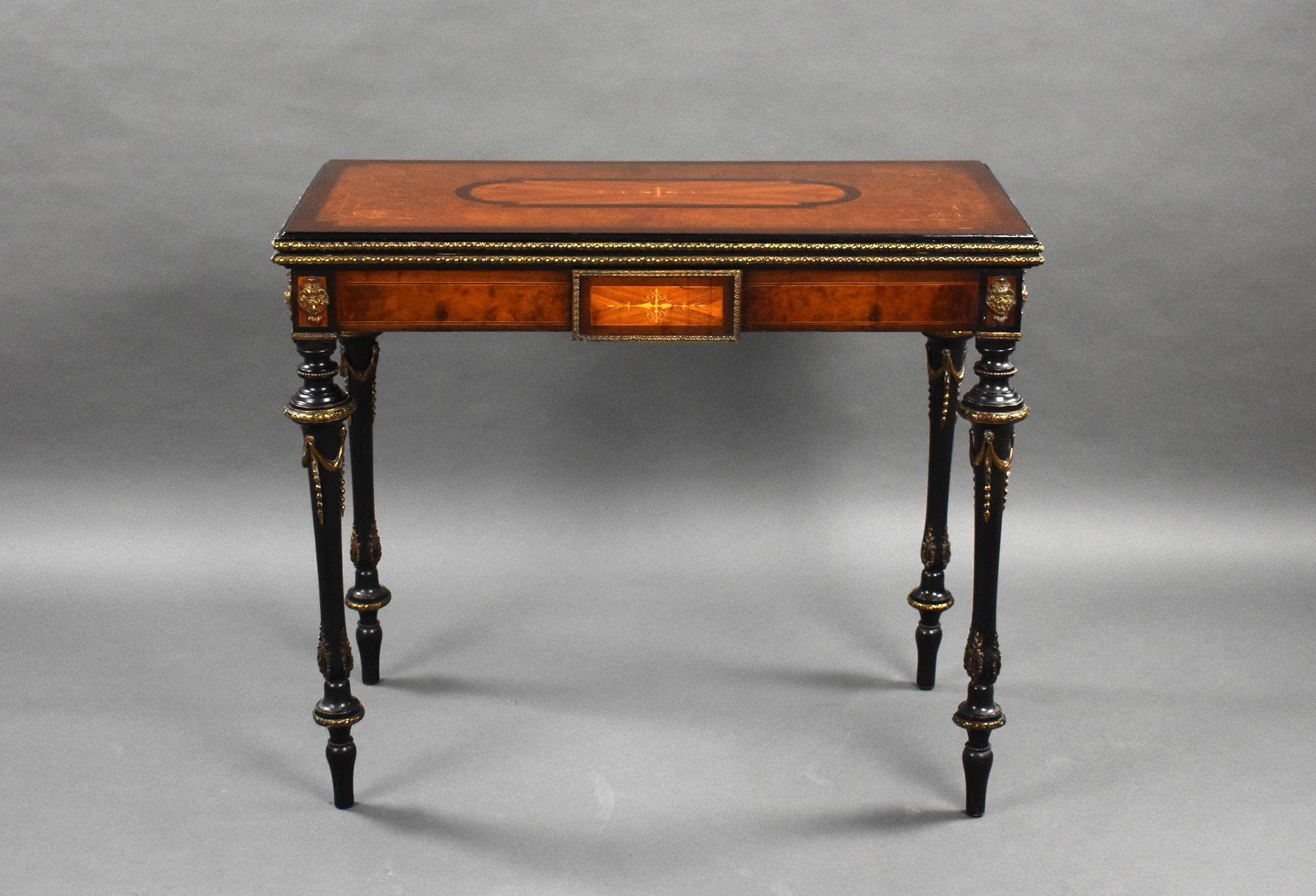 For sale is a very good quality Victorian burr walnut inlaid card table. The top swivels and folds over to reveal a a baise lined interior. Standing on elegantly turned legs decorated with brass ormolu mounts. The card table remains in very good