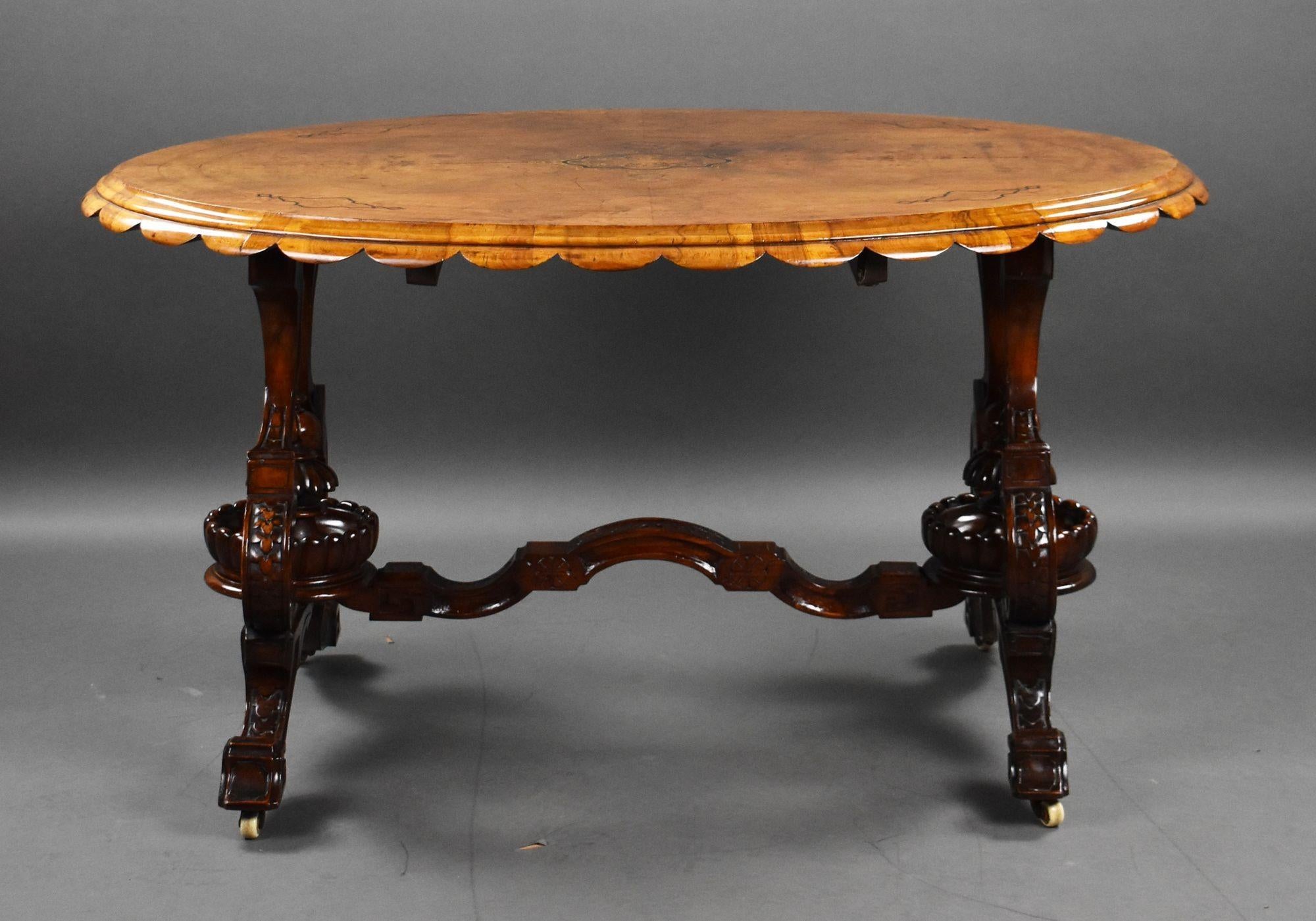 For sale is a top quality Victorian burr walnut inlaid centre table, the well figured top strung and beautifully inlaid above an ornate base united by a central stretcher, raised on castors. The table remains in very good condition, showing minor
