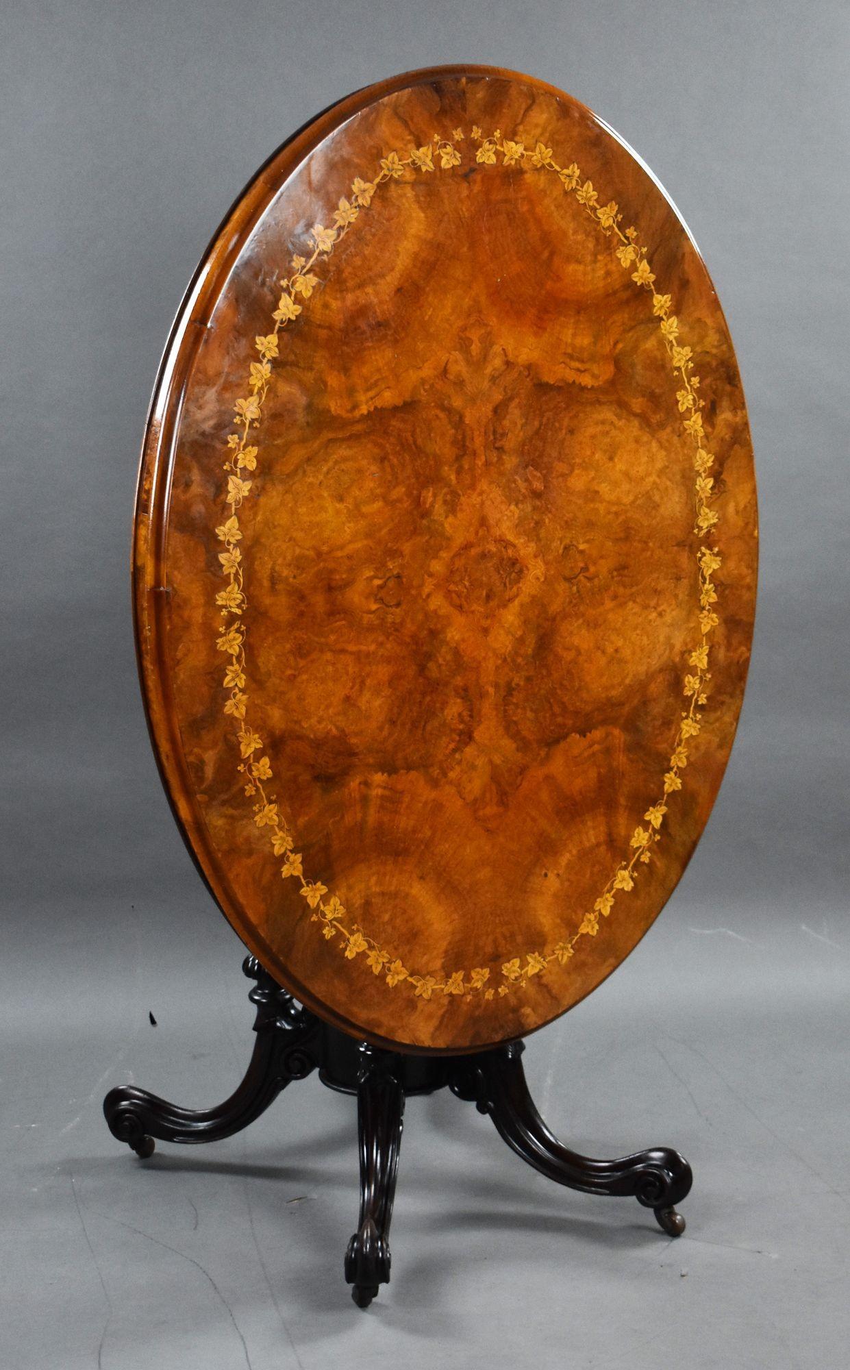 For sale is a good quality Victorian burr walnut inlaid oval loo table, the well figured top inlaid with leaves to the edge, above a birdcage base, raised on elegant splayed legs raised on original castors. The table remains in very good
